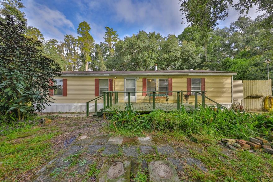 North Lakeland Opportunity! Discover the potential in this 3-bedroom, 2-bath manufactured home built in 1996, perfectly situated on just over 1.5 acres of serene land. This spacious property offers plenty of room to spread out, enjoy privacy, and create your own retreat. The home is livable as-is but ready for a little TLC, making it a fantastic option for buyers looking to add their personal touch or for investors seeking their next project. Recent updates include a newer roof, updated AC handler, and upgraded electrical panel—major improvements that offer peace of mind for the next owner. Conveniently located in North Lakeland, you’ll appreciate the peaceful country feel while still being close to shopping, dining, and major roadways for an easy commute. Don’t miss this chance to turn this property into your dream home or a great investment!