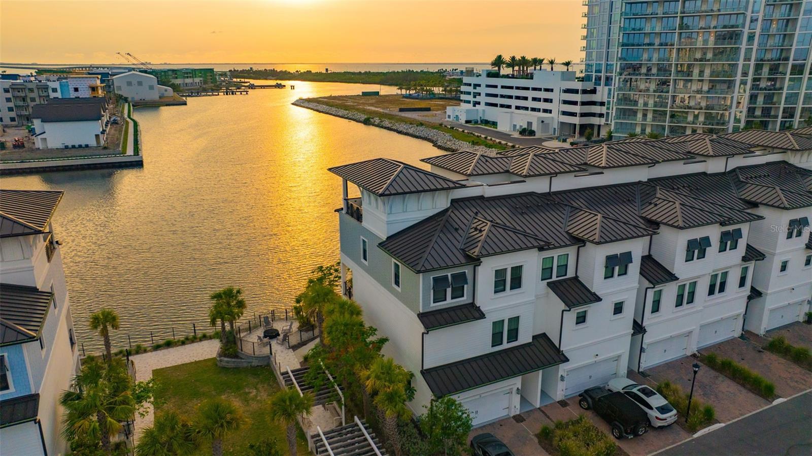 RARE Waterfront End Unit – Mainsail Floor Plan – Premier Location with Panoramic Bay Views!
Welcome to Inlet Shore, where luxury meets the water in South Tampa’s coveted Westshore Marina District! This stunning 4-story end-unit townhome is one of only 14 true waterfront end units and boasts the most desirable location in the community—next to green space, closest to the amenities, and with unobstructed, panoramic views of Tampa Bay. Wake up to dolphins and manatees playing outside your window, and end your day with unforgettable sunset views.
Built to the highest standards and stayed high and dry through Hurricane Helene and Hurricane Milton, this Mainsail floor plan offers 4 bedrooms, 3.5 bathrooms, a private elevator, and high-end finishes throughout. On the first level, enjoy a versatile guest suite or home office with a full bathroom, sitting area, and a covered lanai just steps from the water.
The second floor is a showstopper with soaring ceilings, wood-style tile flooring, and a bright, open-concept living area. The chef’s kitchen includes quartz countertops, a gas stove, stainless steel appliances, walk-in pantry with wood shelving, and a large center island perfect for entertaining. Step out onto the balcony and soak in unmatched bay views.
Upstairs on the third level, the primary suite is a true retreat, featuring serene water views, a spa-like bath with dual vanities and a large walk-in shower with a window overlooking the bay, and a spacious walk-in closet. Two additional bedrooms, a guest bath, and laundry complete this floor.
And finally, the crown jewel: a private rooftop terrace complete with a custom L-shaped bar featuring a built-in grill, two burners, fridge, sink, bar seating, and a covered lounge area with motorized privacy blinds—ideal for entertaining or simply unwinding above the water.
Additional highlights include a 2-car garage, maintenance-free living, and walkability to neighborhood shops and restaurants. Just minutes from Tampa International Airport, downtown Tampa, and an easy drive across the Gandy Bridge to St. Petersburg, this home defines luxury waterfront living.
This is the ultimate lifestyle opportunity—don’t miss your chance to own one of Inlet Shore’s finest residences! Unit can be leased fully furnished, partially or unfurnished.