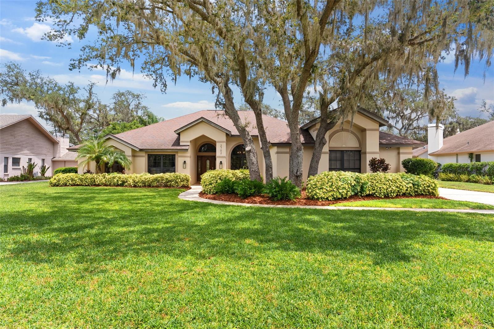 Nestled in the heart of Plant City, where Southern hospitality meets modern living, this beautifully renovated 4-bedroom, 3-bathroom home is located in the highly desirable Walden Lake community. Offering the charm of a small town with the convenience of big-city access, you're just minutes from historic downtown Plant City’s farmer’s markets, strawberry festivals, local boutiques, and beloved family-owned restaurants—while only 25 minutes from Tampa, 15 minutes from Lakeland, and an hour from Orlando. From the moment you arrive, the manicured curb appeal, peaceful surroundings, and welcoming entryway set the tone for what’s inside. Step into a home that has been thoughtfully updated with modern finishes and a neutral color palette designed to complement your personal style. The kitchen seamlessly opens to a cozy dining area and an inviting family room, complete with charming window seats and a newly refaced fireplace—creating the perfect backdrop for everyday living or entertaining guests. You'll also find a flexible formal living and dining/bonus space ideal for gatherings, working from home, or quiet evenings in. The spacious layout gives every family member room to unwind and connect.
Step outside to your own private retreat—this home sits directly on the fairway, offering breathtaking views of the lush green course from your backyard. Whether you're enjoying your morning coffee or winding down in the evening, the golf course setting brings a sense of peace and beauty that's hard to match. And it gets even better—your outdoor space features a screened-in pool and spa, perfect for year-round Florida living. Whether it’s a morning swim, weekend BBQ, or relaxing soak after a long day, this backyard oasis is designed for both comfort and connection. All of this is set within one of Plant City’s most cherished communities—where neighbors know your name and community pride runs deep. With scenic walking trails, peaceful lakes, and a true sense of belonging, Walden Lake offers more than just a neighborhood—it offers a way of life. Don’t miss the chance to make this exceptional home yours. Schedule your private showing today and experience everything that makes this home—and Plant City—so special.
