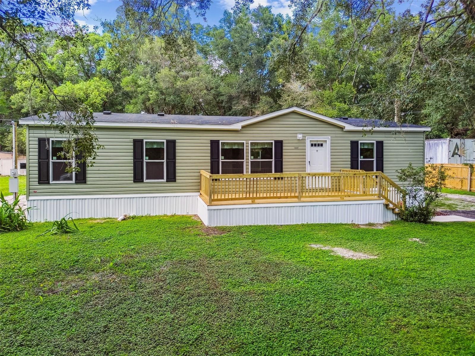 Beautiful & Brand New!
This stunning 3 bedroom, 2 bathroom manufactured home sits on just over half an acre in the peaceful Masaryktown community of Brooksville. Featuring an open concept split-bedroom floor plan, this home was designed with efficiency, comfort, and privacy in mind.
Inside, you’ll find wide plank laminate flooring throughout—both durable and easy to maintain. The bright, open kitchen is perfect for entertaining and includes oak brown cabinetry, brand-new energy-efficient appliances, and a window over the sink with a view of the backyard. All bedrooms are generously sized and feature large walk-in closets for ample storage.
Step out the rear door to a wooden deck and patio, the perfect space for grilling and enjoying your private backyard. The expansive front entry deck adds another inviting outdoor living area.
Everything here is brand new—from the AC unit and appliances to the well pump and the home itself—giving you peace of mind for years to come.
The property also showcases beautiful Grandfather Oaks and is tucked away on a quiet street. With no HOA, you’re free to bring your boat, camper, or trailer, and there’s plenty of room to add a workshop or detached garage.
Conveniently located just 5 minutes from the Veterans Expressway for an easy commute to Tampa and the airport, and less than 10 minutes from Historic Downtown Brooksville, this home combines modern living with country charm.
Don’t miss out—schedule your private showing today!