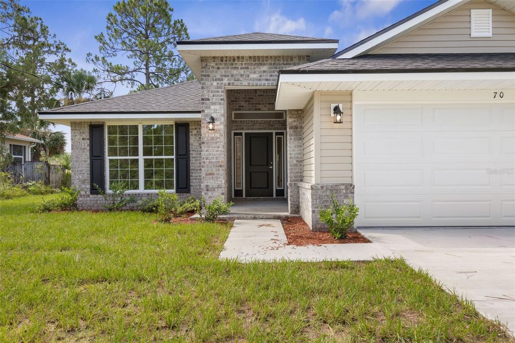 Photo of 23 Brownstone Lane, Palm Coast, FL 32137 (MLS # FC315528)