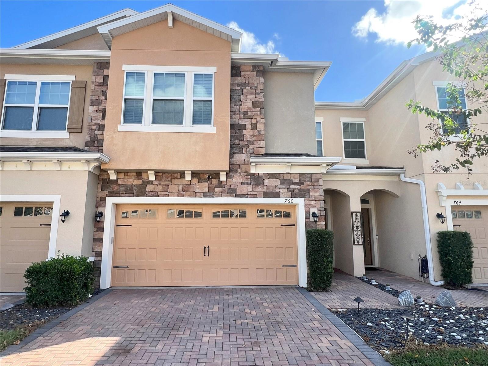WELCOME HOME to this immaculately maintained 3-bedroom, 2.5-bath townhome with a 2-car garage in the Walkers Grove community, Resort Style Living at its finest. Located just a stone's throw from Historic Winter Garden Downtown, the West Orange Trail, farmer's market, restaurants, theater, and Crooked Can Brewery, all within easy reach. The home greets you with a warm front entry, leading to an open and brightly painted living area, and a stunning kitchen that's sure to impress. The chef's kitchen boasts granite countertops, a backsplash, an undermount sink, 42" staggered maple cabinets, stainless steel appliances, recessed lighting, and a full closet pantry. Washer and Dryer included. The upper-level houses all bedrooms, including a master suite bathed in natural light, featuring a large walk-in closet, dual sinks, a walk-in shower, and a garden tub. Additionally, the second floor offers a roomy loft/flex area, two more bedrooms, and another bathroom.