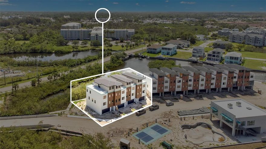 One or more photo(s) has been virtually staged. Under Construction. Discover the ultimate expression of luxury coastal living at Aqua Reserve, an exclusive collection of only 32 meticulously curated residences offering direct, deeded access to the Gulf. This isn't just a home; it's a private retreat designed for the true connoisseur of fine living, offering a perfect blend of high-end design, effortless leisure, and active pursuits. Every detail within these beautifully designed exteriors has been selected to ensure ultimate comfort, luxury, and complete privacy. The chef-inspired kitchen boasts commercial-grade appliances, complemented by Italian-imported, Euro-style wood cabinets with soft-close technology and dramatic Calacatta quartz countertops with stunning waterfall edges. Additional luxury features include a dedicated Coffee/Appliance Bar and Wet Bar with both beverage and wine cooler (plus a bonus wine cooler and ice maker on top floor!). Experience a magnificent flow of light and air, with soaring ceilings that lend an atmosphere of expansive grandeur throughout the home. Every floor offers a private retreat: enjoy the comfort of the screened-in patio on the main level and the private screened-in balcony on the second floor. Finally, ascend to your resort-inspired private rooftop, a spectacular open-air sanctuary with elegant glass railings and panoramic views of the Intracoastal. Enjoy the peace and quiet afforded by block and soundproof demising walls. The home features impact windows and doors for superior protection. A 4-stop private elevator ensures effortless movement across all floors. The 2-car garage boast epoxy flooring for a refined, low-maintenance foundation. Modern living is enhanced by tankless water heaters and elegant step lighting on each floor. Aqua Reserve is a gated community designed to enhance every facet of your lifestyle, blending upscale leisure with active living against a backdrop of serene natural surroundings. 
For the dedicated boating enthusiast, Aqua Reserve provides an unparalleled gateway to the Gulf. The community's private boat dock is a short, effortless trip to open water, and it features premium amenities designed for convenience and a superior experience.
Each slip will be equipped with individual power and water hookups, access to private dockside showers, and dedicated fish cleaning stations. Indulge in the luxury tropical modern pool, surrounded by chic cabanas, day beds/chaise lounges, ample lounge seating, and an outdoor shower. The community center is the heart of social life, offering indoor/outdoor seating and tables with TVs, 2 outdoor commercial grills, and kitchen. Stay active at the fully equipped Aqua Fit Fitness Center, featuring both cardio and strength training equipment with on-demand fitness technology. Challenge friends on the dedicated Pickleball Court, chipping green or enjoy the tranquility of the approximately 1-mile scenic walking trail around the community, with easy access to nearby preserves and parks.

This is your opportunity to secure a bespoke residence that redefines Florida waterfront luxury.

For more information or to schedule a private tour of this extraordinary new community, please contact us today.