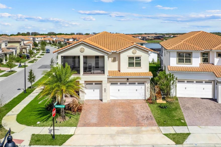 Experience luxury living in Eagle Creek, one of Lake Nona’s premier gated golf course communities. Built in 2022, this stunning Jones Homes Sandhill model is situated on a premium corner lot directly across from a community playground with convenient access to neighborhood mailboxes. This spacious 5-bedroom, 5-bath home was thoughtfully designed with flexibility in mind, making it ideal for multigenerational living. The home features primary suites on both the first and second floors along with dual laundry rooms for added convenience. The bright open-concept floor plan is filled with natural light and showcases soaring ceilings, modern finishes, and a chef-inspired kitchen with stainless steel appliances and a large center island overlooking the living and dining areas—perfect for entertaining or everyday living. Step outside to your private backyard retreat featuring a sparkling pool, covered lanai, and outdoor kitchen, creating the perfect space for relaxing and enjoying Florida living year-round. Additional highlights include a 3-car garage and a desirable corner lot location within the community. Residents of Eagle Creek enjoy resort-style amenities, including a championship golf course, multiple community pools, clubhouse dining, fitness center, tennis courts, playgrounds, and 24-hour gated security. Eagle Creek Elementary is conveniently located within the community, and you are just minutes from Lake Nona Medical City, Lake Nona Town Center, Boxi Park, the USTA National Campus, as well as shopping, dining, and major highways. A rare opportunity to own a luxury home offering space, flexibility, and an exceptional Lake Nona location.