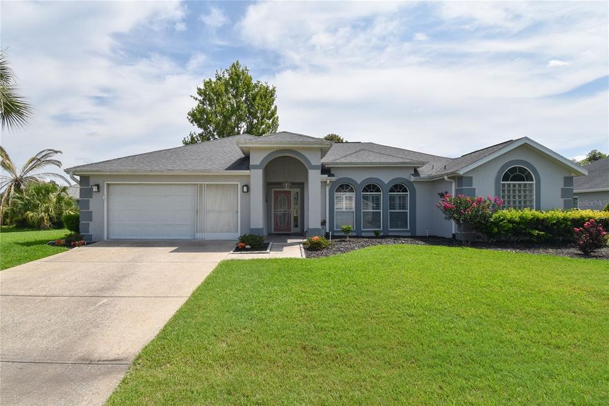 LOCATED ON A CUL-DE-SAC, this 2BD/2BA house is on a corner lot and has lush landscaping that leads to the house. This house has a formal living  room with three windows in the front, with Plantation Shutters, tile flooring and a ceiling fan with lights. The dining room also has tile flooring and a new modern lighting fixture. The kitchen has Granite Countertops, a new refrigerator and microwave, a time-saving dishwasher, ceiling fan with lights and clear top range. The Family room is located off of the kitchen area and has new laminate flooring, ceiling fans with lights and a hidden closet under the kitchen cabinets for private storage. The Master bedroom has tile flooring, a tray ceiling, two separate closets and has a ceiling fan with lights and two separate windows for ventilation. The Master bathroom has Granite countertops, two sink vanity with plenty of storage, a 'new' walk-in shower, and a soaking tub and medicine cabinet. The second bedroom has a full-length closet for lots of storage and new flooring. There is additional storage at the end of the hallway. The guest bathroom has a walk-in shower and vanity. The inside laundry room is located off of the Family room and has extra storage cabinets. The 2-car garage has a separate air conditioner for working in your garage. The backyard is perfect for just relaxing and enjoying life. Furniture can be purchased outside of sale.  A/C (2025)  Ocala Palms offers a pristine golf course, indoor and outdoor pools, and fitness center. Situated in a prime location, this home is just a short drive from the World Equestrian Center (WEC) and nearby shopping and restaurants are just across the street. Embrace the vibrant lifestyle and numerous amenities that Ocala Palms has to offer in this exceptional home. All measurements are approximate. Buyer(s) to re-measure.