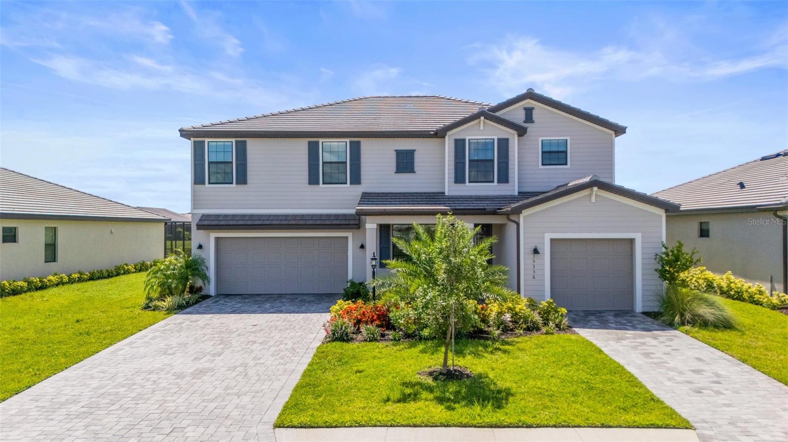Discover sophisticated living in this luxurious 5-bedroom, 4.5-bathroom home, ideally located in the tranquil Lorraine Lakes community of Lakewood Ranch, FL. Designed for comfort and grand entertaining, this home offers three spacious living areas. The lanai promises serenity among the impressive wide view of the lake. Inside, an open-concept kitchen, lounge, and dining area flow seamlessly, with bi-fold doors opening to sun-drenched pool views and a galleried landing adding architectural elegance. Separate formal dining and breakfast rooms, plus a generous entrance hall, provide ample space for any family's needs. Each of the five double bedrooms features its own en-suite bathroom for ultimate privacy. A 3-car garage and driveway parking offer convenience. Residents also gain access to unparalleled resort-style amenities, including a serviced bar and restaurant, a fully-equipped gym, various sports courts (tennis, pickleball, volleyball, basketball), a putting green, two swimming pools, and a splash park.