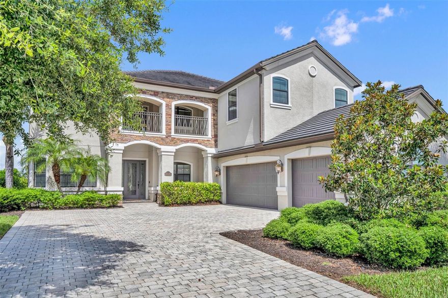 MOTIVATED SELLERS!

A fresh new price and opportunity to own a move-in ready home with room for everyone and a setting that feels like vacation every day. 

Welcome to 5531 Arnie Loop, a spacious and beautifully appointed residence in the gated community of Lakewood National. Set along sweeping lake views and the renowned Arnold Palmer-designed golf course, this home brings together generous indoor living, resort-style outdoor spaces, and a floor plan designed for both connection and privacy.
Step through the front door and you're greeted with soaring ceilings, natural light, and thoughtful architectural detail throughout. At the heart of the home is a chef-inspired kitchen featuring a gas cooktop, double ovens, granite counters, tile backsplash, and a welcoming breakfast nook overlooking the pool.

The main living area opens effortlessly to an impressive two-story screened lanai where you’ll find a saltwater pool, heated spa, and outdoor kitchen ready for sunrise coffees or evening gatherings under the sky. A private first-floor guest suite offers convenient access to the pool bath, ideal for visitors.

Upstairs, you’ll find a spacious loft perfect for a media room, creative workspace, or lounge. The primary suite feels like a private retreat with its own screened balcony showcasing water and golf views, dual walk-in closets, and a generous spa-style bath with soaking tub and walk-in shower. A second upstairs suite provides comfort and privacy for extended family or long-term guests, while the additional bedrooms provide direct access to the expansive upper balcony.
Additional highlights include formal living and dining rooms and a side-load three-car garage, all wrapped in abundant natural light and a welcoming sense of openness.

As a resident of Lakewood National, you’ll enjoy access to an incredible list of amenities: two championship golf courses, clubhouse dining, resort-style zero-entry pool with tiki bar, full-service spa, fitness center with classes, tennis, pickleball, bocce, and more, all within a maintenance-free setting.

And you're just minutes to highly rated schools, shopping and dining, convenient I-75 access, and some of Sarasota’s most celebrated beaches. The best part, you can buy this home with NO INCOME VERIFICATION required!