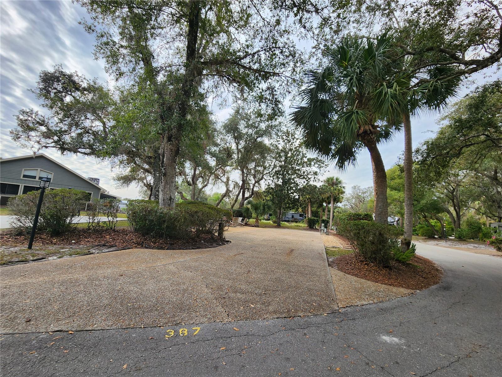 Welcome to your dream RV lot, located in the sought-after Phase 4 of River Ranch RV Resort. This huge corner lot combines space, convenience, and natural charm, making it the perfect choice for your outdoor lifestyle; No Rear Neighbors; Seconds away from the Phase 4 pool, showers/restrooms, and laundry facilities Abundant Mature trees offering shade and a tranquil setting
Built-in firepit for cozy gatherings, Swing for relaxing in the serene atmosphere; Access to tennis courts, pickleball, shuffleboard, and bocce ball
Convenient proximity to Westgate River Ranch Resort & Rodeo, featuring dining options and a variety of activities (additional fees apply)
Prime corner location providing extra space and privacy; Beautifully landscaped with plenty of room to relax and entertain
Lot is currently in Resorts Rental program with upcoming bookings! Let your property make you money when you aren't using it!