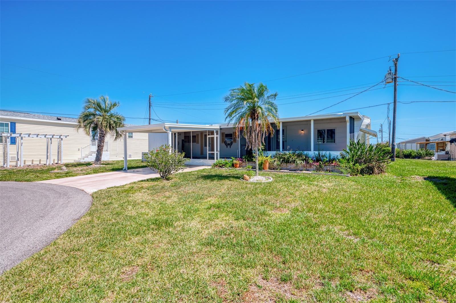 55+ COMMUNITY!! Welcome to this charming 2-bedroom, 2-bathroom home in the heart of the sunny secret city of Nokomis, FL. This property is in on a quiet cul-de-sac in an amazing location. just off of SR-681, I-75 and US-41 and minutes to the amazing Nokomis Beach. Lake Village is a quiet, friendly community offering great amenities like a sparkling pool and hot rub, clubhouse and shuffleboard courts, perfect for relaxing and enjoying the Florida lifestyle. Inside this home, you’ll find a bedroom with an en-suite bathroom, along with a 2nd bedroom that could also work as an office, and another full bath The kitchen and living area is open and inviting with plenty of space. Off the living room, is a huge lanai to relax and/or entertain guests. To make this property complete the front has a huge covered porch with your own laundry room. This area offers a lot of room for storage or just another outdoor oasis. Water IS included with utilities. Don't miss out on this one! Schedule your showing today!