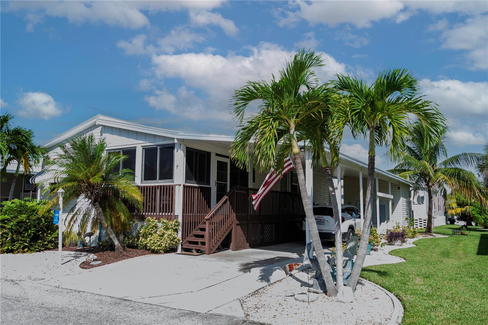 Discover carefree living in this charming 1,008 sq. ft. home in the vibrant 55+ community of Windmill Village, built in 2005 in Punta Gorda, voted “#1 Best Small Place to Live” by Money Magazine and Forbes. This 2-bedroom, 2-bathroom gem features a spacious living room and sitting room combination, an eat-in kitchen with ample cupboards and storage, and clam shell hurricane shutters for peace of mind. The $256 monthly HOA fee covers water, sewer, trash, lawn care, and common area maintenance, freeing you to enjoy an active lifestyle with two private marinas, a boat ramp, trailer storage, horseshoe pits, shuffleboard, bocce ball, billiards, indoor pickleball, and a large community center with clubs for every hobby. Relax at the Pavilion by the heated pool, perfect for gatherings. The purchase price excludes a refundable $18,285 Buy-In Share and Bond. Don’t miss this beautifully maintained home—schedule your showing today and embrace paradise in Windmill Village!