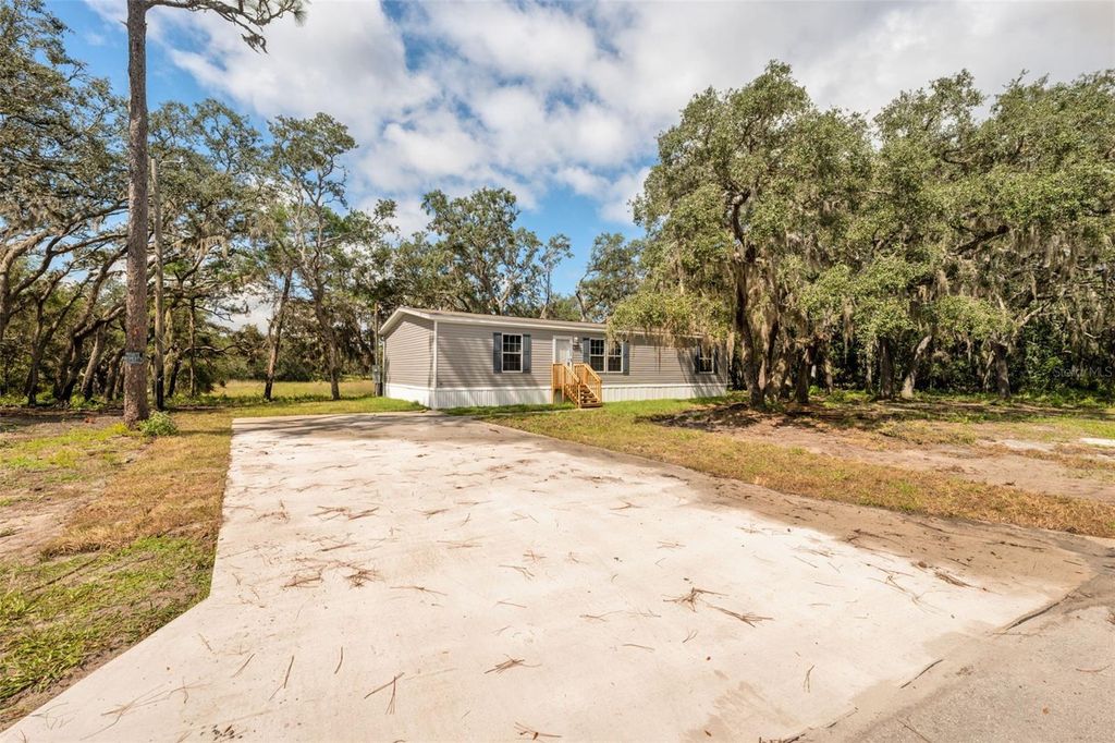 Photo of 18223 Long Lake Drive, Hudson, FL 34667 (MLS # TB8433989)