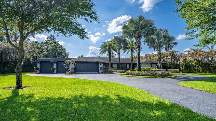 One or more photo(s) has been virtually staged. You've found your Lakefront Vacation Home!  Welcome to Lake Placid, Florida's private waterfront sanctuary on the breathtaking shores of Lake Huntley, located 5 minutes from popular Lake June.  This charming and upscale one story ranch style home offers over 9,000 sqft and just over 4,600 sqft of living space providing the perfect blend of luxury and serenity- designed for grand entertaining, peaceful everyday living, and a vacation/rental opportunity. Boasting with 6 spacious bedrooms plus an additional bonus room that can be used as an office.  Car enthusiast and outdoor lovers alike will appreciate the expansive four car garage ideal for vehicles, boats, water toys, and golf carts. At the heart of the home, a chef inspired kitchen features dual oversized islands and two refrigerators, making hosting effortless and elegant. The open layout flows seamlessly into an entertainers dream with pool table and game room.  This split floorplan, includes a primary suite with a walk-in closet and bathroom with dual sinks and shower.  Step outside into your personal resort with a screened in pool, a jacuzzi framed by lush arbor for ultimate privacy and a tranquil screened lanai off of the primary suite. The properties beach entry leads directly into the lake where your private dual boat dock awaits and plenty of space for your water toys.  Encased with a privacy estate wall with an electric gate and keypad entry, this home offers unmatched exclusivity and security.  This is more than a home- it's a Lifestyle!