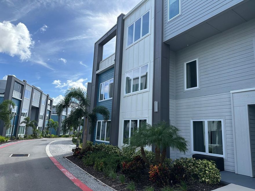 Welcome to Spectrum Resort, your perfect getaway just minutes from Disney and Orlando’s world-famous theme parks. This stunning 3-bedroom, 3-bathroom condo offers the ideal blend of luxury, comfort, and convenience, highlighted by a spacious private terrace overlooking a beautiful golf course. The contemporary kitchen is a true centerpiece, featuring elegant quartz waterfall countertops, premium stainless steel appliances, and a sleek modern design. High ceilings and an open-concept layout create a bright, airy atmosphere that enhances the home’s beautiful style. The residence is offered fully furnished with a professionally designed furniture package valued at over $50,000, making it completely move-in or rental ready. Unlike purchasing from a developer, this property is essentially brand new—without the wait and at a better value. Golf enthusiasts will appreciate the golf membership included, providing access to three well designed private courses: Tradition by Jack Nicklaus, Legacy by Arnold Palmer, and Independence by Tom Watson. Resort-style amenities are truly exceptional. Relax at the 20-acre lazy river water park, enjoy the tennis courts, or stay active in the fully equipped fitness center. The community also features 11 resort-style pools, ensuring there is always a place to unwind and cool off. For added convenience, complimentary shuttles to Magic Kingdom and nearby attractions make visiting the parks effortless. Located in a gated resort community with no rental restrictions, this property offers outstanding flexibility as both a luxury vacation home and a high-potential investment opportunity, ideal for short-term or long-term rentals.