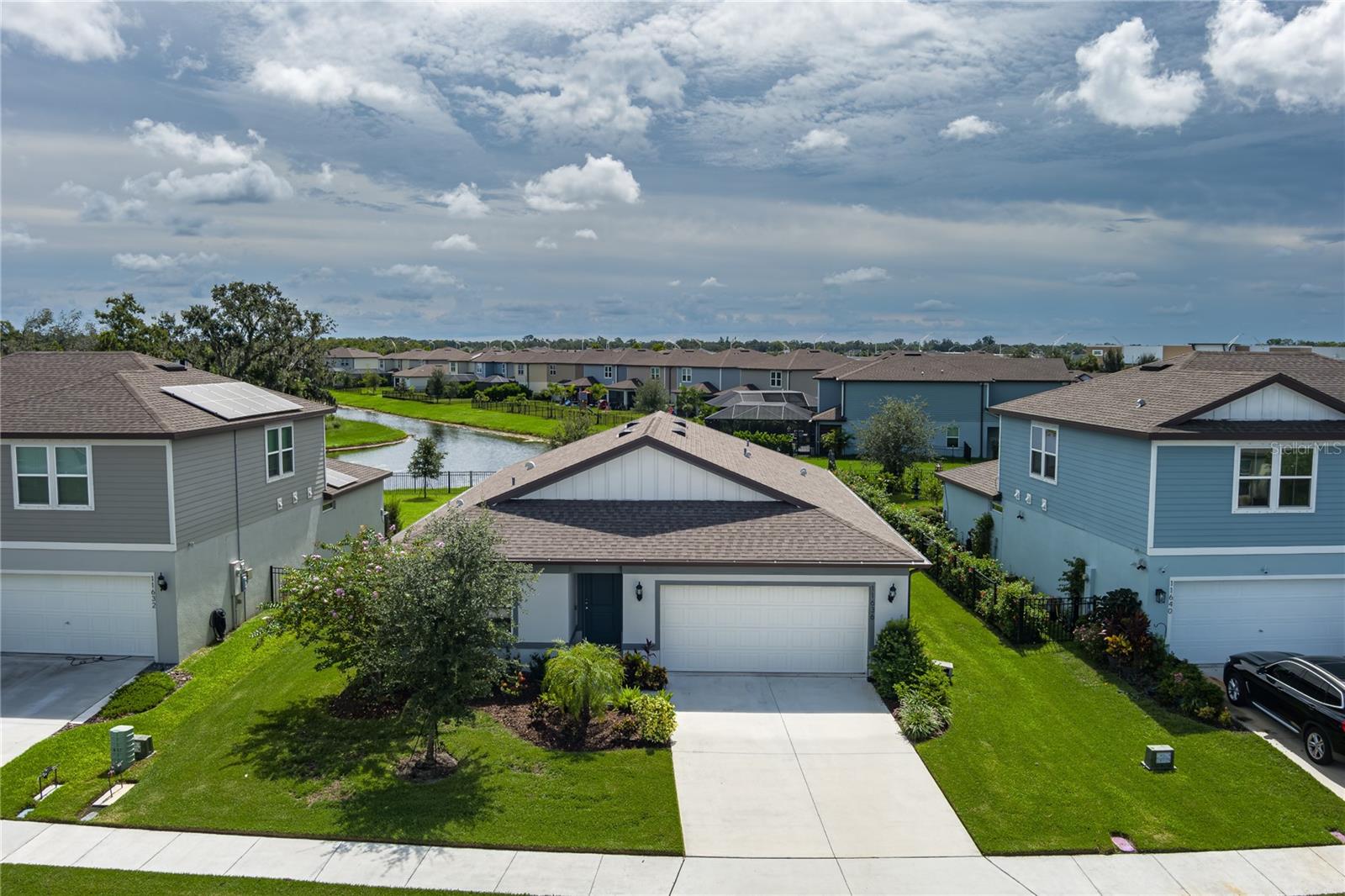 Welcome to this stunning 4-bedroom, 2-bathroom single-story home located in the highly sought-after North River Ranch community. Built in 2022 and located in a non-flood zone, this beautifully maintained residence offers modern living with thoughtful upgrades throughout. The home comes partially furnished and features elegant espresso cabinets, sleek quartz countertops, and a spacious kitchen with island seating—perfect for entertaining. Rain gutters and irrigation around the home add to the convenience, while the 220V 50-amp outlet in the garage makes charging electric vehicles a breeze. The mostly fenced-in backyard backs up to a serene common area with no future building planned, offering peaceful views of the river and added privacy. Additional features include hurricane shutters, a two-car garage, and access to top-tier community amenities. North River Ranch boasts three resort-style pools—including a brand-new pool with a waterslide—along with tennis and pickleball courts, playgrounds, a fitness center, biking and walking trails, a skate park, and more. Families will appreciate proximity to top-rated schools such as Barbara A. Harvey Elementary, Buffalo Creek Middle, Parrish Community High School, and the brand-new Harvey K-8 located right within North River Ranch. With easy access to I-75, nearby shopping, exciting new restaurants, and plans for a new hospital coming in 2027, this home truly has it all. Don’t miss your chance to own a piece of paradise in one of the area’s fastest growing and most vibrant communities!