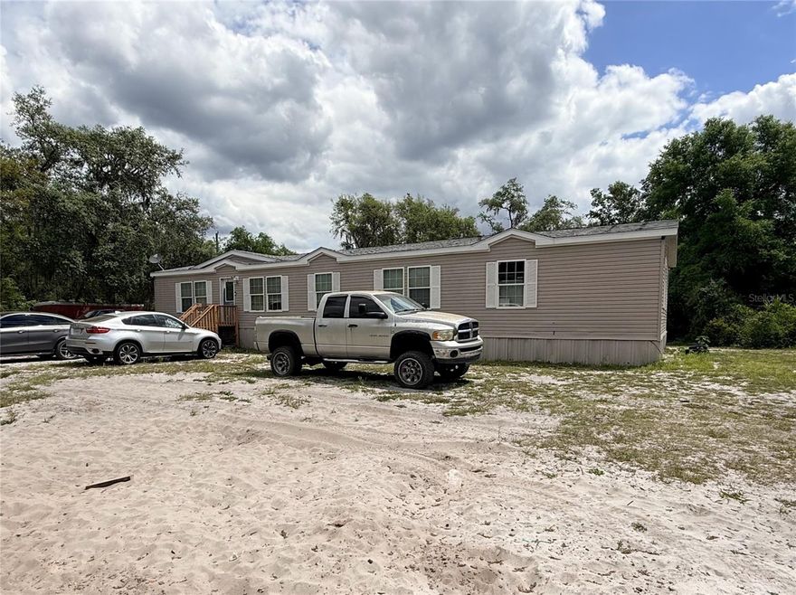 Attention investors and visionaries, your next project starts here.  Set on a generous 0.64-acre lot in the quiet surroundings of Umatilla, this 4-bedroom, 2-bath manufactured home offers a rare opportunity to create value from the ground up. Built in 2008 and ready for a full transformation, this property is the perfect canvas for those looking to renovate, redesign, or reimagine.  The expansive lot provides ample space for outdoor enhancements, additions, or simply enjoying the privacy and open nature setting. A pier foundation and existing storage shed add to the property’s functionality, giving you a solid framework to bring your ideas to life.  Whether you're a seasoned investor, contractor, or buyer with a vision, opportunities like this don’t come around often.   Schedule your showing today and explore the possibilities firsthand.