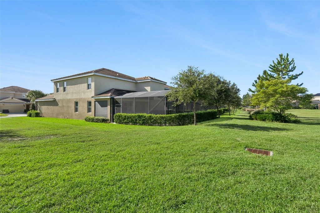 Photo of 7646 Oakmoss Loop, Davenport, FL 33837 (MLS # O6452530)