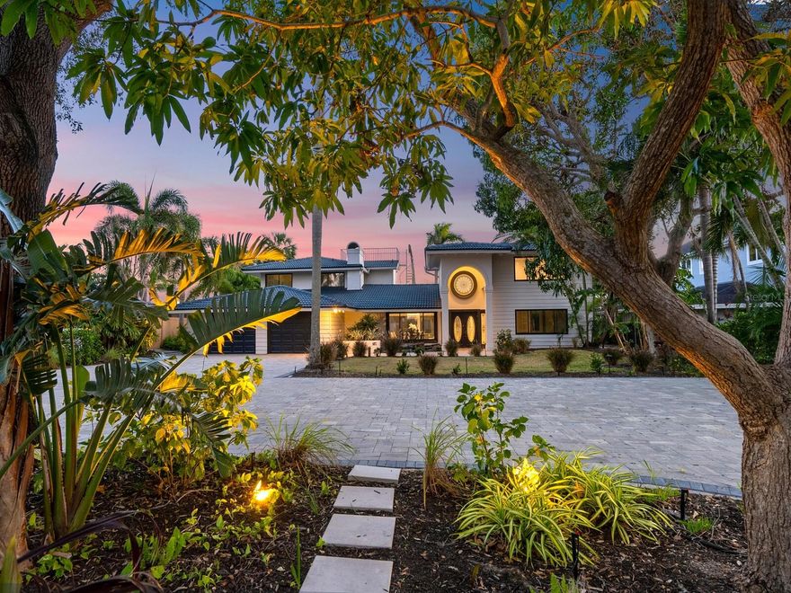 New price - $650,000 reduction! An exceptional location for serious boaters who value deep sailboat water and quick access to Sarasota Bay, Big Pass and the Gulf of Mexico. Experience the best of waterfront living and the Siesta Key lifestyle on Bay Island, the coveted northern tip of Siesta Key. For investors, this large six-bedroom home is in an area with impressive vacation rental potential in one of the finest boating locations in the area. Gated and walled, this estate is the ultimate for privacy and living the saltwater island life. Enter an oasis canopied by mature, lush landscaping with mango and avocado trees to the expansive paver motor courtyard which offers parking for numerous cars and toys. With spectacular harbor views from the front door, the home's bright, open floor plan offers soaring beamed ceilings anchored by a wood-burning fireplace in the large dining room. A wall of glass spans the adjoining waterfront great room. An island kitchen, breakfast room, media room, guest suite and one-and-half baths complete the main living level. Two separate second-floor living areas flank this spacious home and are connected by a rooftop deck with an additional observation deck overlooking the pool and large waterfront yard, offering spectacular views of the deep-water boating harbor. The waterfront master suite offers a full bath and office; the upstairs guest wing offers three bedrooms and a full bath. Outdoors, relax in the sun by the oversized waterfront pool. Boasting 90 feet of waterfront, the large dock and 15,000-pound boat lift with water and electric offer an array of outdoor fun – just minutes to the bay and Gulf to savor fabulous Siesta Key sunsets or fish, paddleboard and kayak from your own dock; you'll enjoy colorful sunrises and amazing marine life, including dolphin and manatee. Plans are included for a two-story, guesthouse/multi-bay expansion of the air-conditioned two-car garage. Natural gas-powered generator and underground lines. Conveniently located, the famous white quartz Siesta Beach sand and azure Gulf water are minutes away. Sarasota’s vibrant downtown with restaurants, shopping, entertainment, and cultural events is a short 10 minutes by auto over the Siesta Drive Bridge.