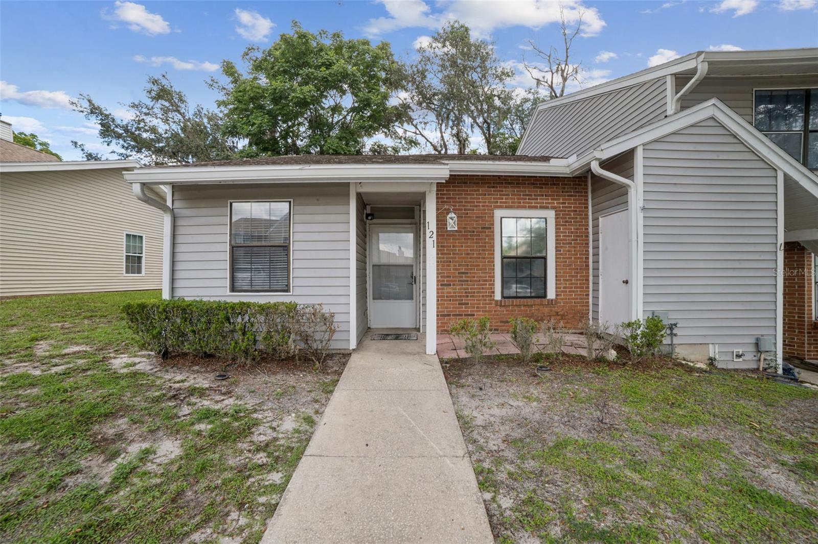 Step into this charming Remodeled 2-bedroom, 2-bathroom end-unit villa nestled in the sought-after Hidden Lake community of Sanford. This delightful home combines comfort and convenience in a serene setting. Upon entering, you’ll find a thoughtfully designed kitchen adorned with granite countertops and ample cabinet space, perfect for all your culinary needs. Beyond the kitchen, the spacious living and dining area welcomes you with a cozy fireplace, vaulted ceilings, and durable vinyl flooring throughout, creating an inviting and open atmosphere. The primary bedroom is tucked away at the back of the villa for ultimate privacy and features generous closet space and an en-suite bathroom with a standalone shower. Toward the front of the home, the second bedroom is ideally located near the guest bathroom, complete with a tub/shower combination. Sliding glass doors in the living room lead you to a private patio, perfect for morning coffee or evening relaxation. Additional conveniences include an in-unit laundry closet for your everyday needs. Hidden Lake offers residents access to a sparkling community pool and is just minutes from Seminole State College, downtown Lake Mary, and Orlando Sanford International Airport. Enjoy a variety of nearby shopping, dining, and entertainment options, all while savoring the peaceful ambiance of this lovely community. Don’t miss the chance to call this Hidden Lake gem your home!