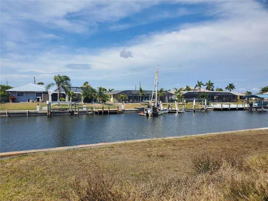 Create the custom waterfront home you’ve always envisioned in the sought-after Gulf Cove community, where boating and coastal living are part of everyday life. This prime homesite boasts an impressive 80-foot seawall, offering a fantastic foundation for a private dock and effortless access to Florida’s scenic waterways. Public water and sewer available! Ideally located just minutes from stunning Gulf Coast beaches, waterfront dining, boutique shopping, and world-class fishing, and a short drive to Port Charlotte, Englewood, Venice, and North Port, this property places you at the heart of it all. Secure your slice of paradise and start living the laid-back coastal lifestyle you’ve been dreaming of!