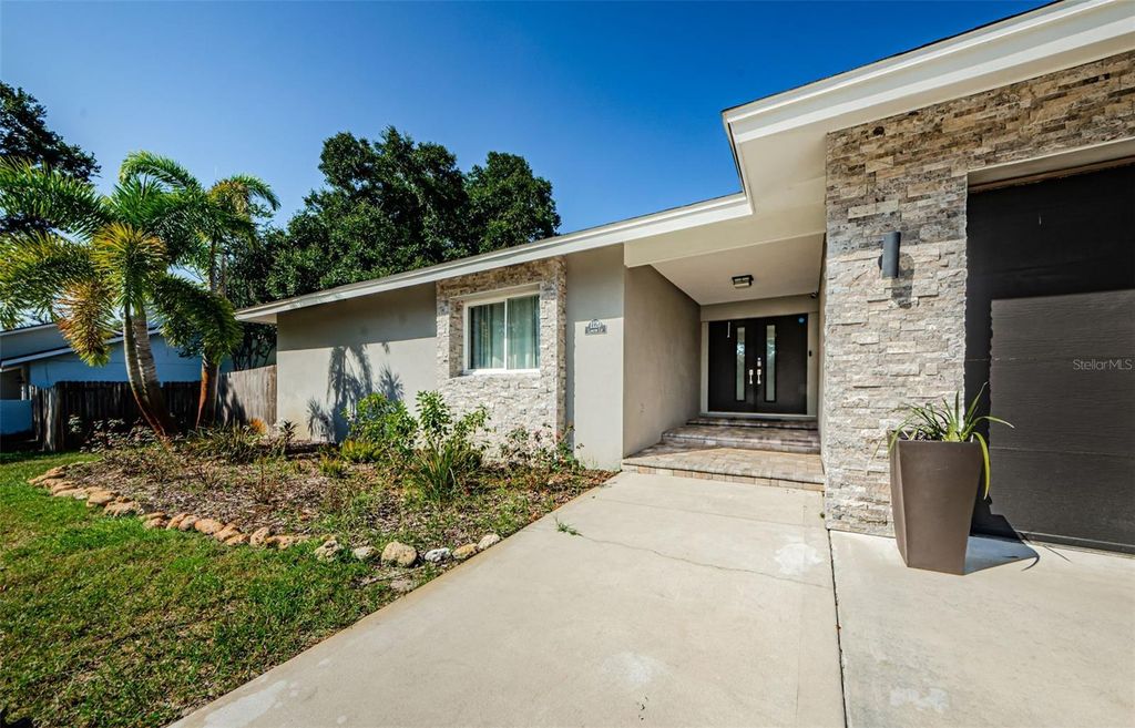 Photo of 1120 Lancer Ln, Tarpon Springs, FL 34689 (MLS # TB8404222)