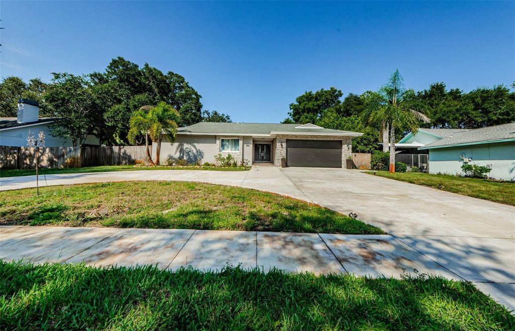 Photo of 1120 Lancer Ln, Tarpon Springs, FL 34689 (MLS # TB8404222)