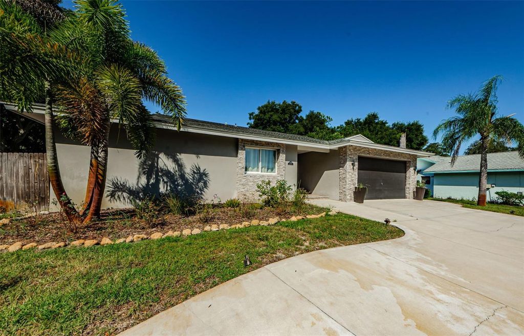 Photo of 1120 Lancer Ln, Tarpon Springs, FL 34689 (MLS # TB8404222)