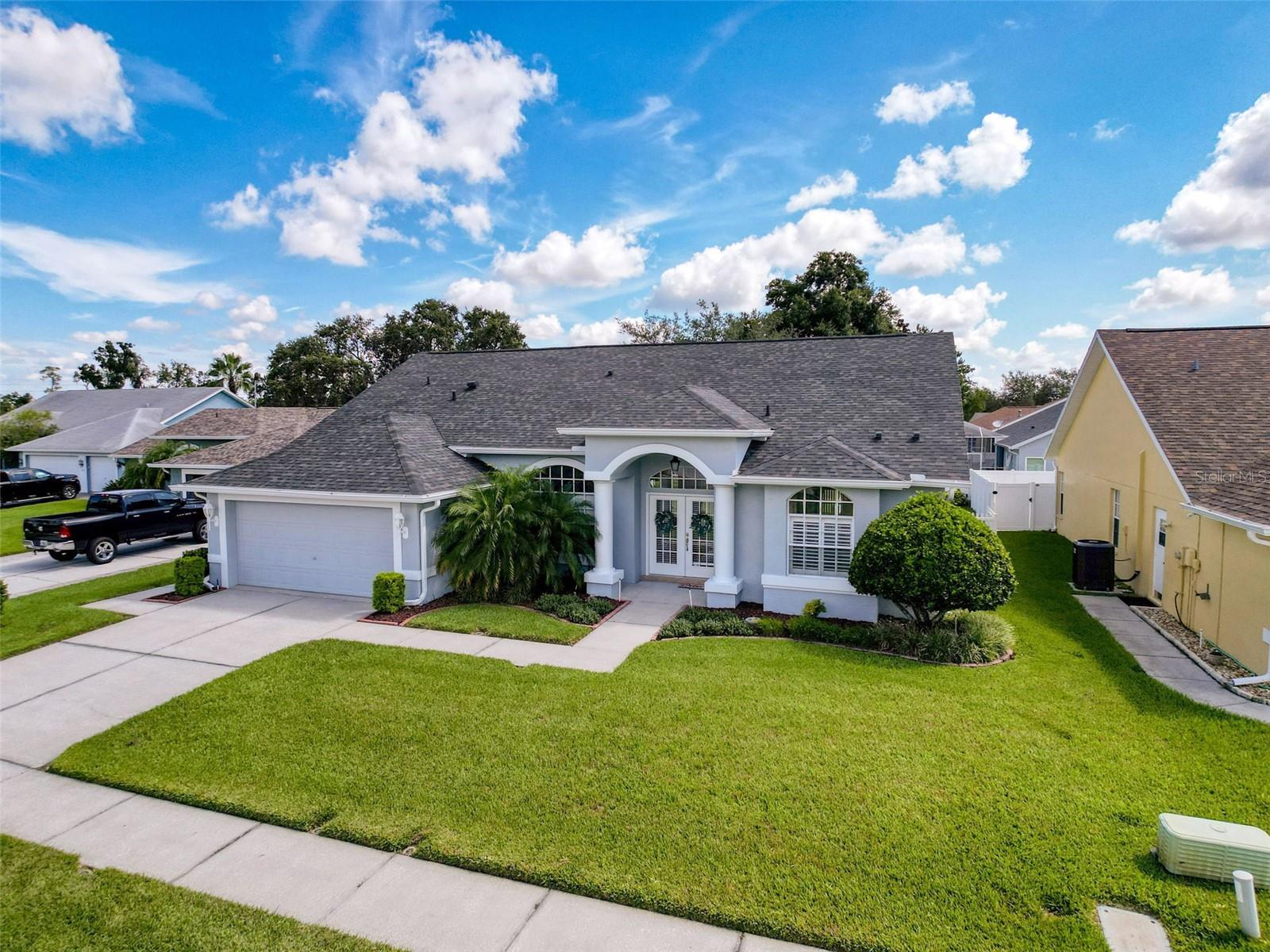Welcome to Your Dream Home in Rosewood at River Ridge!
Step into comfort and style with this beautifully maintained home located in the sought-after Rosewood community—a peaceful enclave tucked inside River Ridge. From the moment you walk up to the charming double front doors with decorative glass accents, you’ll feel the warm, Florida vibe this home exudes.
Inside, you’ll find elegant porcelain tile in the bedrooms and rich wood flooring in both the formal living and dining rooms. The kitchen is light, bright, and functional—featuring crisp light cabinetry, neutral countertops, stainless steel appliances, a pantry, and a breakfast bar, perfect for everyday living or entertaining. There’s also a cozy breakfast nook that overlooks the expansive screened lanai.
The master suite is a true retreat, with sliding glass doors that lead directly to the lanai, a large walk-in closet, and a spacious en suite bath complete with a garden tub, walk-in shower, and dual sinks with light cabinets and quartz countertops. Bonus:there’s even a “fancy mirror”—a fun and unique touch! The secondary bathroom has been updated with matching finishes for a cohesive, modern feel.
The lanai is an entertainer’s paradise, overlooking a tranquil pond and lush landscaping, with plumbing and electrical in place for a future outdoor kitchen. Plus, a small fenced area is ready for your four-legged friend to enjoy.
Notable upgrades include a new AC (7/2025), new bedroom windows, and a new roof (2020). Large windows throughout the home fill the space with natural light, creating a bright and airy atmosphere.
Located just minutes from top-rated schools, shopping, and the Veterans Expressway, this home offers easy access to Tampa, St. Pete, and beyond. Whether you’re commuting for work or heading out for adventure, this location makes it a breeze.
Don’t miss your chance to own this exceptional home in one of the area’s most desirable communities. Schedule your private showing today!