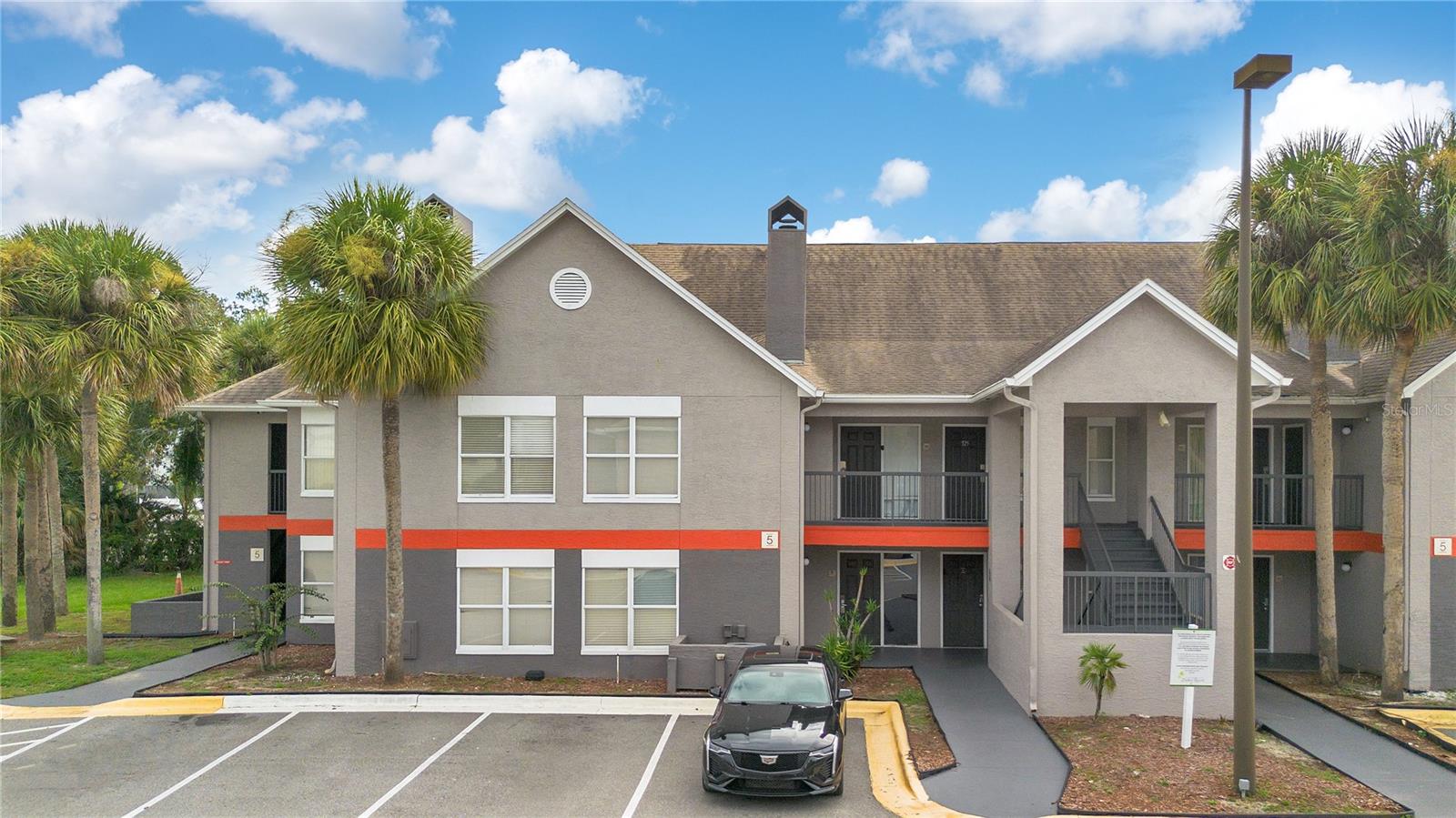 Remodeled and turnkey, furnished 1-bedroom, 1-bath Disney-themed, condo located in the sought-after Parkway Palms Resort, just minutes from Walt Disney World and Orlando’s world-class attractions. This beautifully renovated, freshly painted unit features an open floor plan with a comfortable living area including a fireplace and smart tv, kitchenette, and private bedroom for relaxation after a day of fun. The unit highlights modern updates including new LVP flooring, all new, upgraded kitchen cabinets, quartz counters, an attractive backsplash, under cabinet lighting, a new cooktop, dishwasher, microwave and a new full sink. Property comes with a seller-provided one-year warranty for added peace of mind. The community provides fantastic resort-style amenities including a sparkling pool, hot tub, fitness center, basketball court, picnic areas with BBQ grills, and a clubhouse with a laundry area and games. HOA fees include water, electricity, internet, pest control, trash and exterior maintenance, truly making it a hassle-free investment or vacation retreat. Perfect for short-term rental income, a personal getaway, or both—you don’t want to miss this opportunity!