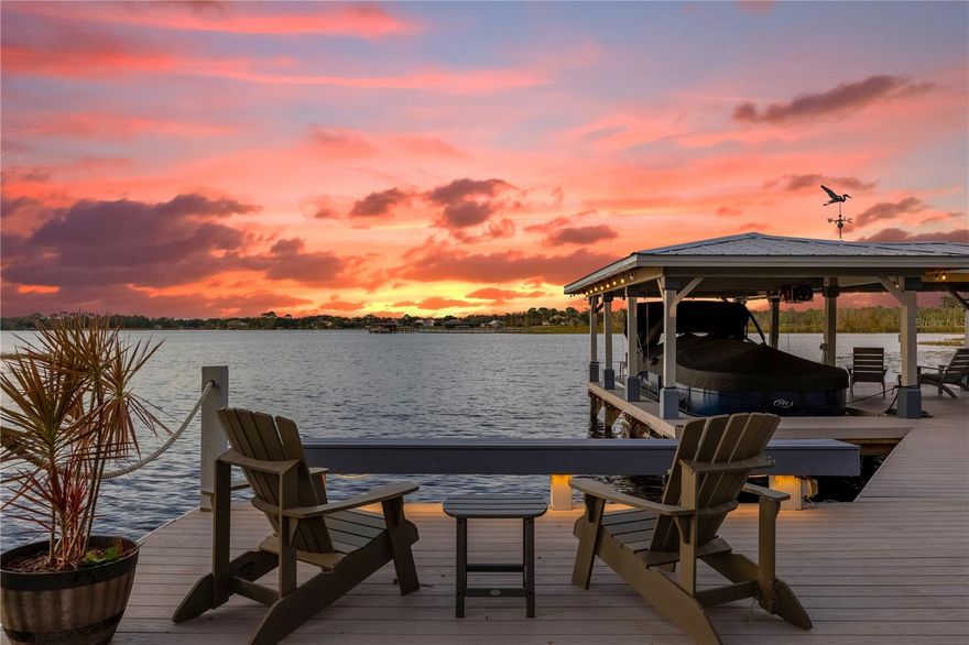 One or more photo(s) has been virtually staged. Nestled on the pristine shores of Lake Sylvan, this 2016 custom-built masterpiece offers an unparalleled blend of elegance and adventure. From the moment you enter through the double doors, be captivated by breathtaking, panoramic water views that stretch for miles. The open floorplan offers the perfect space for entertaining with large sliders allowing for the ideal indoor and outdoor lifestyle. Dive into year-round enjoyment with your heated saltwater pool, perfect for swimming and relaxation in every season. Enjoy cooking in the oversized kitchen, complete with a large island, a walk-in pantry and a cozy coffee station. The wood-burning fireplace adds warmth and charm to the space. This beautiful four-bedroom, four-bathroom home features high ceilings, abundance of natural light and tranquility. The downstairs bedroom can easily be converted into an in-law suite, providing additional privacy for guests or family members. The primary bedroom on the second floor features a private balcony, perfect for enjoying gorgeous sunset skies over the lake. A large 3-car garage ensures plenty of space for vehicles and storage and experience the ultimate lake life at its finest with your very own boat dock and boathouse, perfect for summer adventures and leisurely afternoons. Easily launch your boat or jet ski with the convenience of your own private boat slip, making water adventures a breeze. Don’t miss your chance to own this exceptional home on Sylvan Lake! Schedule a showing today!