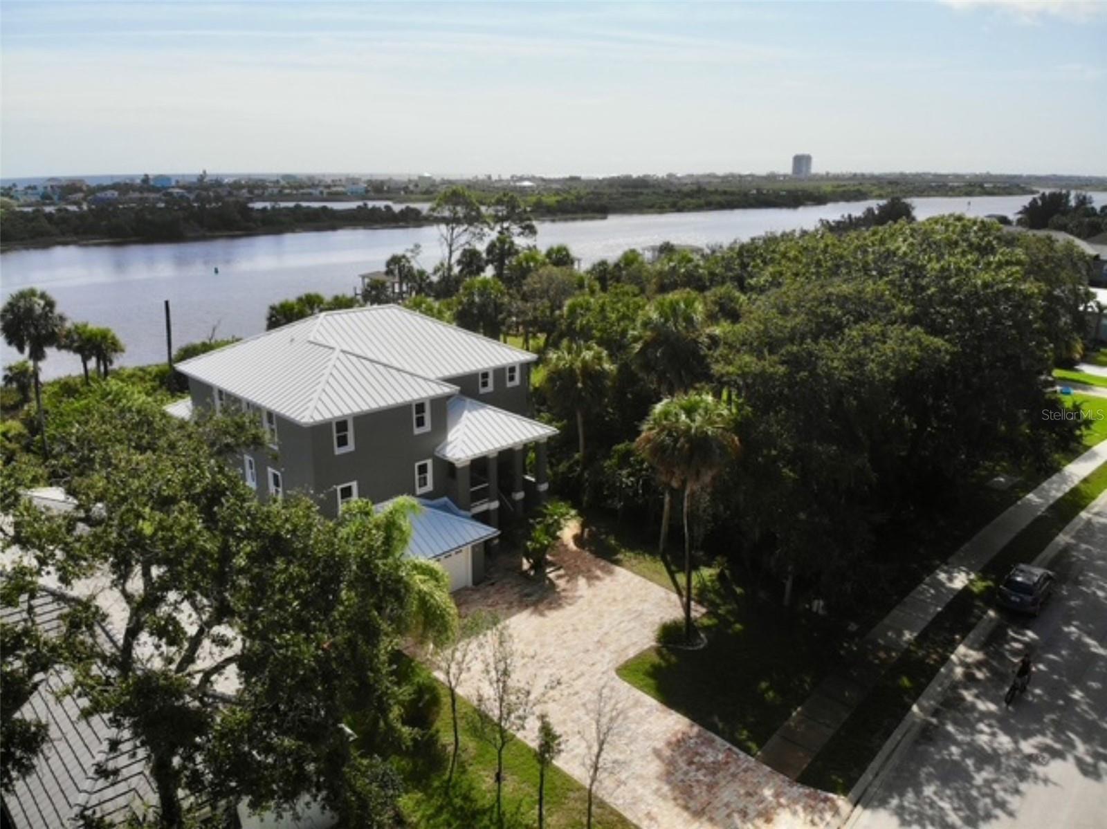 HIGH & DRY | BUILT TO LAST | NEARLY COMPLETE COASTAL MASTERPIECE
Experience the ultimate in Florida coastal living with this nearly completed, custom-built home nestled in the gated community of Palm Coast Plantation with million dollar coastal views. Priced $40K under appraisal and has Certificate of Occupancy - move in immediately and complete at your own pace. Engineered for durability and peace of mind, this three-story residence features solid, foam-injected concrete block construction, a three-story concrete elevator shaft, and a commercial-grade, standing seam alloy metal roof with spray foam insulation underneath. Designed with resilience and refinement in mind, the high-end sand-finish stucco exterior is complemented by a stunning travertine stone driveway, patios, stairs, and garden beds, providing timeless curb appeal and low-maintenance elegance. Inside, thoughtful construction includes: Double-layer subfloors on upper levels, sound-insulated interior walls and elevated flooring insulation, impact-rated PGT Miami sliding doors and windows, coastal-rated A/C systems for year-round comfort. The spacious garage (approx. 1,000 sq ft) offers room for up to six vehicles, plus flexibility for a home office, gym, or studio. An EV charger is also installed. A 768 sq ft guest or in-law suite with a separate entrance, full bath, and plumbed kitchenette offers private accommodation for extended family or visitors. The home is almost complete, giving you the unique opportunity to personalize the finishing touches. Choose your preferred interior paint, cabinetry, countertops, flooring, plumbing fixtures, and lighting—a vetted contractor list is available, including those already familiar with the property. Layout highlights include: Second Floor: an expansive great room, an open-concept kitchen and dining area, a full bath, a bonus room/office, and a spacious bedroom. Third Floor: The primary suite with spa-style ensuite, two additional bedrooms, two full bathrooms, and an Elevator-ready shaft for seamless access to all floors. Enjoy breathtaking ocean and tranquil preserve views of a 44-acre Florida State Preserve from the rear of the home. Boaters will appreciate the deep saltwater canal access in the backyard, ready for a large boat dock and lift. Owners will also enjoy the ability to install a 15’x30’ pool plus sun shelf the current owner has already designed and had approved – much larger than ANY of the neighboring properties can accommodate. Palm Coast Plantation offers an unrivaled lifestyle with resort-style amenities: 24-hour manned security gate, clubhouse with new renovations, resort-style pool, hot tub, and pool, tennis, pickleball, basketball, and shuffleboard courts, fitness center, playgrounds, fishing piers, walking trails, and RV/boat storage. Elevated. Engineered. Exceptional.
Schedule your private showing today and imagine the possibilities of making this coastal gem your forever home.