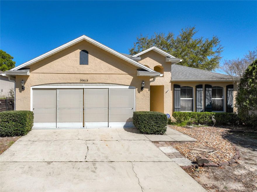 Current PRICE REDUCED by $11k. A $5,000 buyer's incentive. Welcome to this great starter home, 3-bedroom, 2-bathroom that is a perfect blend for comfort, style, and peace of mind. This home features a new roof (2021), new laminated wood flooring, new AC unit (2025), new washer and dryer, and a new refrigerator . This home has been thoughtfully maintained for worry-free living. The kitchen contains granite counter-tops along with wooden cabinets. The spacious split floor plan allows for both privacy and flow, while the open-concept living and dining areas are perfect for everyday living or entertaining. Furniture show cased inside is with listing price and surround sound wiring in family room and patio with ceiling speakers.  With a 2-car garage and a generous backyard with a screened in patio space (no view of neighbors), this home is the one you’ve been waiting for. Just minutes from SR-429 for effortless commuting to Orlando.