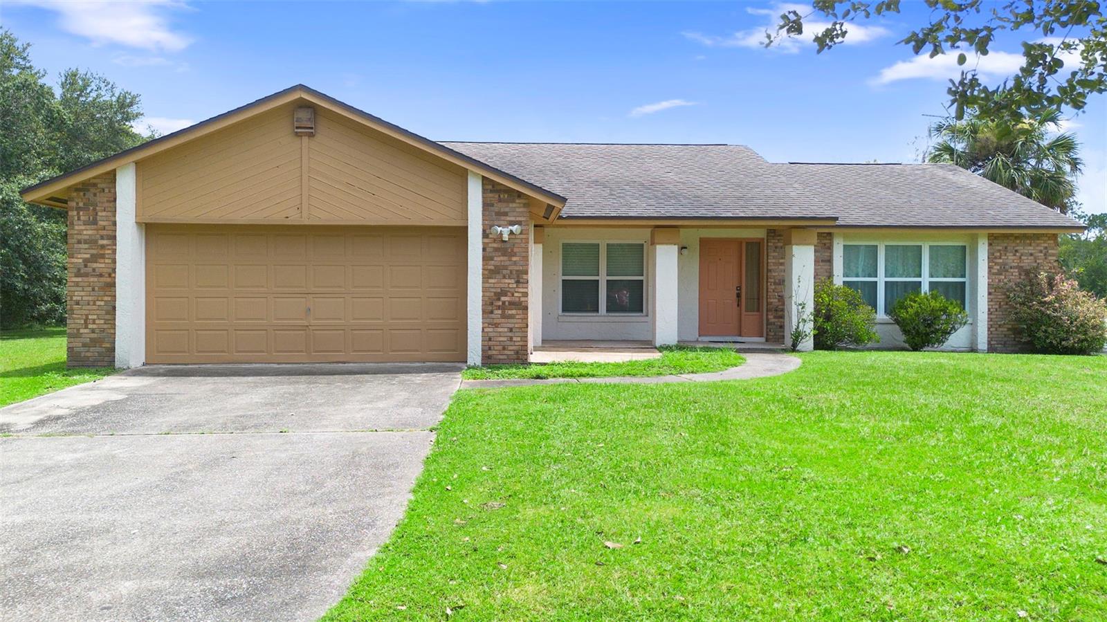 Welcome Home to country living with NO HOA! 3-bedroom / 2-bathroom residential home with 1,766 heated square fee that features an open and ideal floor plan sitting on 2.47 acres with an attached 2-car garage. Screened-in back porch off the kitchen offers views of the expansive lot and features a car port providing additional covered space. Plenty of living space as home includes a living room and a family room. New AC and new water heater were just installed in July of 2025. The home is perfectly situated on the lot allowing for expansion with endless possibilities without the hassle of an HOA. A "hard to find" opportunity to acquire a move-in ready home PLUS securing additional space with this large lot providing you distance from your neighbors and allowing you the freedom and outdoor space to enjoy as you wish. Additionally, the location is optimal as your close enough to shopping, restaurants, schools, UCF, SR50 and 408 but far enough away to enjoy a quiet and serene lifestyle. Schedule your showing today and Welcome Home to country living!