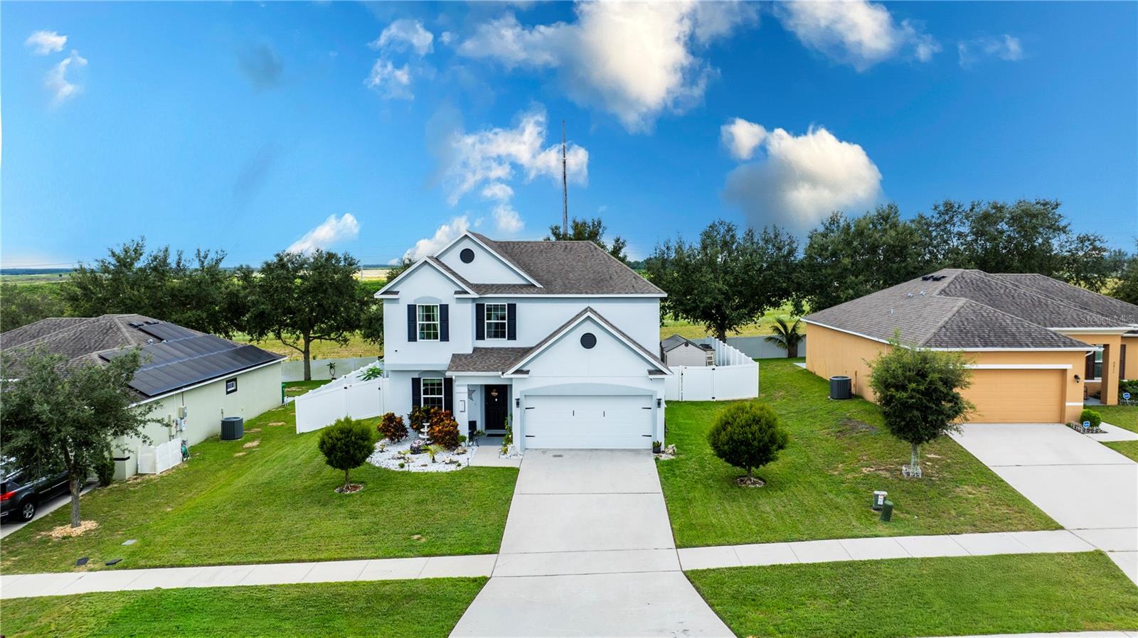 Take a look at this SPACIOUS 2-STORY HOME featuring 3 BEDROOMS, 2.5 BATHS, 2-CAR GARAGE PLUS AN UPSTAIRS LOFT that could be used as a HOME OFFICE or easily converted into a 4TH BEDROOM. The home offers FLEX SPACES for all your family’s needs. If you are looking for SPACE AND COMFORT, LOOK NO FURTHER!
On the main level, you will find an OPEN FLOOR PLAN with a beautiful KITCHEN ISLAND that opens into the gathering room. The UPGRADED KITCHEN includes BLACK APPLIANCES, WOOD CABINETS, AND ELEGANT GRANITE COUNTERTOPS. Tile flooring runs throughout the main living areas with carpet only upstairs and in bedrooms.
Step outside to a LARGE BACKYARD WITH BRAND-NEW FENCING, perfect for gatherings or relaxation. Best of all, this home includes ENERGY-SAVING SOLAR PANELS that CONVEY WITH THE HOME—helping you SAVE MONEY while enjoying modern efficiency.
Located in an AMAZING COMMUNITY WITH NO CDD AND VERY LOW HOA, this property is CLOSE TO LEGOLAND, just 30 MINUTES TO MAJOR THEME PARKS, within walking distance of MABEL LAKE PARK, and offers CONVENIENT ACCESS TO MAJOR HIGHWAYS. Visiting Orlando or Tampa Bay’s attractions will be a breeze!
MOVE-IN READY and waiting for its NEW OWNERS. Don’t delay—SCHEDULE YOUR PRIVATE TOUR TODAY and take advantage of this GREAT OPPORTUNITY to own a beautiful Florida home with solar panels INCLUDED IN THE PRICE!