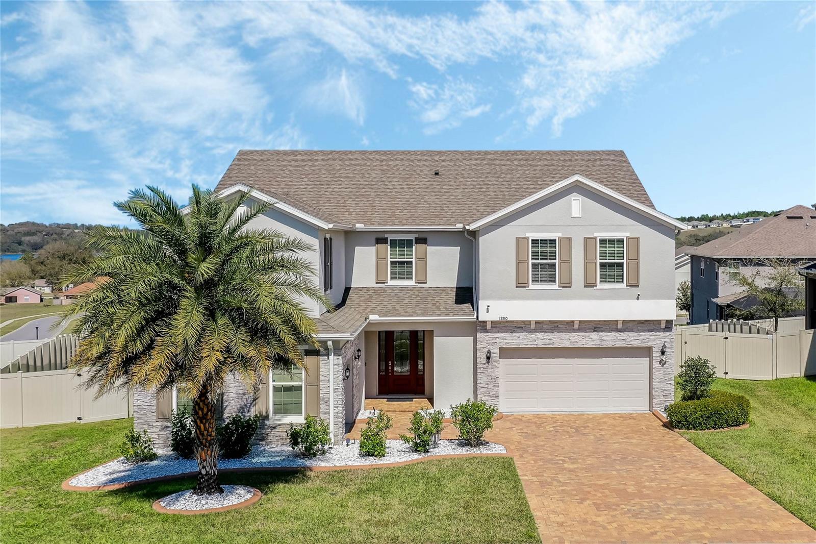 MASSIVE PRICE RREDUCTION! - Here is your opportunity to OWN this Pristine Luxurious Home. Built in 2019 and one of the most Spacious Homes in this well sought after Community of Ardmore Reserve. This Spectacular Oasis of a home features 5 Bedrooms, 4 Full Bathrooms and 1 half bath, a Den/Office, an Extra Flex Room and a Massive Loft. With over 4600 Sq.Ft. of living space, you will not be cramped in this beauty. Home has OVER $85,000 IN BUILDERS UPGRADES. This amazing, meticulously well maintained, ready to move in home brings a wealth of options for you and your family. This house has barely been lived in as 4 of the 5 bedrooms has never been used. One of the half baths on the first floor has been converted into a custom full bathroom. Entire downstairs has Laminate floors. Stairs and second floor have custom Berber carpet. All the secondary bathrooms have dual sinks with Quartz counter tops and laminate floors. The Gourmet Kitchen is a dream to any family chef with Stainless Steel Appliances, Double Oven, Gas Range, Pantry, and a beautiful Island for Family Gatherings. Home also feature Huge Living Room, Formal Dining Room and Kitchen Nook. Let’s not forget the Office/Den with Double French Doors fit for an Executive, Quite Meditation Room or however it may benefit your Family. There is a second flex room being used as a bedroom on the first floor. The Extravagant Owners Suite Features His/Her Separate Sinks with Quartz Counter Tops. Never Used Soaking Garden Tub, Stand up shower, His and Hers Walk-In Closet and Wood Look Tile Floor. There are TWO Stairways to get upstairs. Wall downstairs has been cut to create open feel to second floor with custom Spindle. Enclosed Lanai Leading to Custom 13X16 Paved Deck. Vinyl Fenced Yard with Paved Driveway and 3 Car Garage. Let's Call This One HOME!