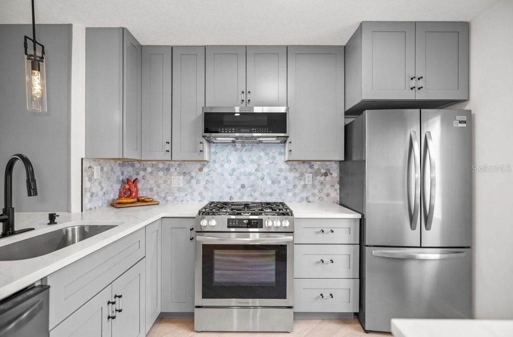 Photo of 1280 Mission Circle, Clearwater, FL 33759 (MLS # TB8463870)