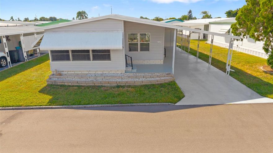 Welcome to on Lake Conley a large Mobile Home Park in the city of Holiday Florida of Pasco County! This is a Gated 55+ Community with MULTIPLE amenities and a very low community fee. **No lot Rent here so you own the land** The Amenities include: Community Boat Ramp, Fishing Pier, Clubhouse, heated Pool, Shuffleboard Court, Horseshoe Court, Lakefront Dock to sit and enjoy sunset, RV/Boat Parking and much more! This double wide mobile home is 1,056sqft and bright with a lot of natural light all throughout the home. From the exterior you have a large Carport, Large Shed with Shelves and the Washer & Dryer plus the Whole Home Water Softener System. The Inside is charming with a great layout complete with 2 Bedrooms, 2 Bathrooms, Kitchen, large Living room, Dining Space with Built In cabinets, and an enclosed patio. Some of the Updates include: New AC SYSTEM 2024, New Electrical Panel, New Carpet, New GFCI throughout, New Hot Water Neater 2024, Plumbing Updated throughout with New toilets, New sub flooring 3/4 plywood in living and dining room areas, and more, Priced to Sell! Add to your short list to see and buy before its gone. *Lake Conley is a Golf Cart Friendly updated Community with a very low HOA fee of only $60 a month* Reminder that this versatile space, featuring Updated Sliders, can be used as an office or casual hangout area. Also this home offers a relaxed Florida living lifestyle that is centrally located to all shopping, restaurants, less than 20 minutes to Florida's most beautiful beaches, Places of worship, nature trails, Parks and many outdoor entertainment. to sum it up: Lake Conley is highly sought after for its privacy, amenities, low HOA fees, location, Gated, Golf carts welcome, Storage, Boast ramp, own your lot, and peaceful surroundings! Call for additional information!