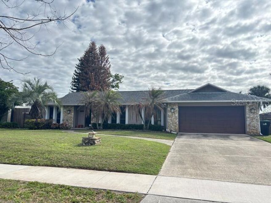Welcome to this charming home located in a peaceful Orlando neighborhood. This property features a spacious split floor plan 3 bedrooms, 2 bathrooms with ample natural light throughout. Tiles and wood flooring. Beautiful wood fireplace in the family room. The backyard is fenced-in for a private space with a patio for outdoor relaxation, overlooking a pond. Large lot 1/3 acre in the middle of Orlando. 
Roof 2018. Elevation Certification available. Plumbing and AC are up to date.
Conveniently located near shopping (Publix, Walmart), hospital, highways... The Rio Pinar golf course and clubhouse is a golfcart ride away.