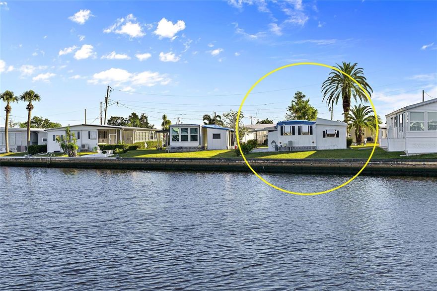 Waterfront Gulf Access fixer-upper! Excellent opportunity to purchase a home on a rare MAIN CANAL lot in a popular community nestled along the majestic Myakka River. This Harbor Cove property has BIG WATER VIEWS in both directions overlooking a 160 foot (M/L) wide waterway. Home has hurricane damage and needs repairs and updating. Buyers can either repair existing home or remove and replace with a new model. HOA lease fee is only $99 per year and no other lot rent! Seawall is maintained by the HOA. Buyers have 1 year from closing date to make exterior repairs required by the HOA. Lanai can either be repaired or removed. Bathroom remodel was started but was stopped. Electric panels and pedestal plus plumbing underneath home have been updated. Washer and dryer are located in the side shed. Home is in the pet section and has a nice front porch area. This amenity rich community offers a 90 slip marina, 2 story clubhouse, 2 pools, spa, storage compound, fitness center, pickleball, tennis, shuffleboard and bocce ball. Join a club for crafts or woodworking and have fun at the dances, shows, card games, bingo, etc.  Shopping, dining, grocery stores and medical services are nearby in both North Port and Venice. Gorgeous gulf coast area beaches are a short driving distance away as well as spring training facilities, Warm Mineral Springs and other attractions. Don't miss out on this chance to create the perfect waterfront lifestyle in this affordable boating community in Southwest Florida. Call today to schedule a showing!