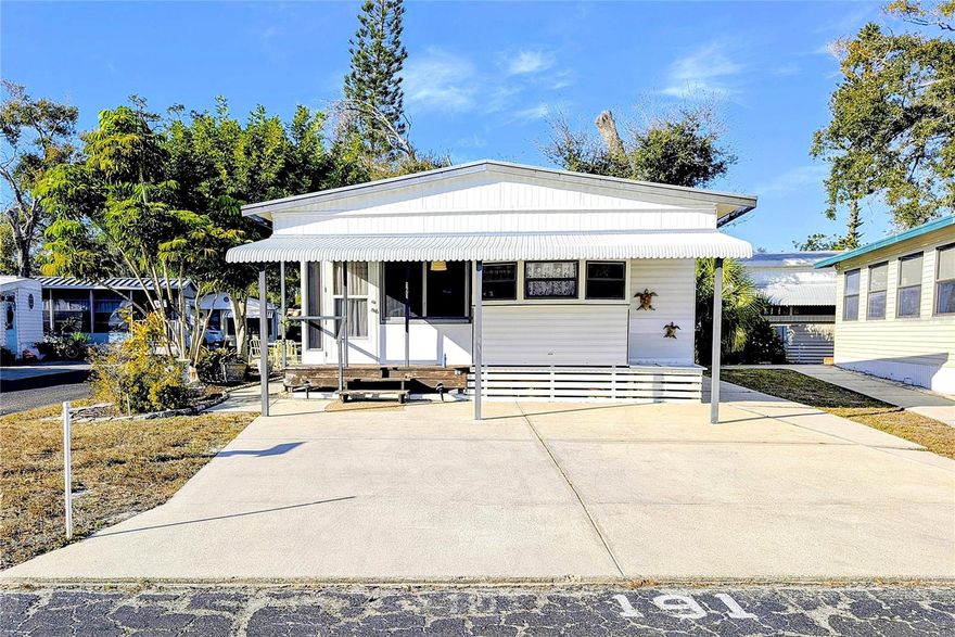 This place has had some upgrades! Upgrades include new walk-in shower, new bathroom fixtures and toilet, and new flooring. This home is located on a manicured corner lot and a lovely covered porch. This community features an active seasonal schedule for the community including, large heated pool, miniature golf, pickleball and tennis courts, a billiard room, shuffleboard and clubhouse to meet and greet friend and neighbors. You don't want to miss this newly upgraded and furnished home.