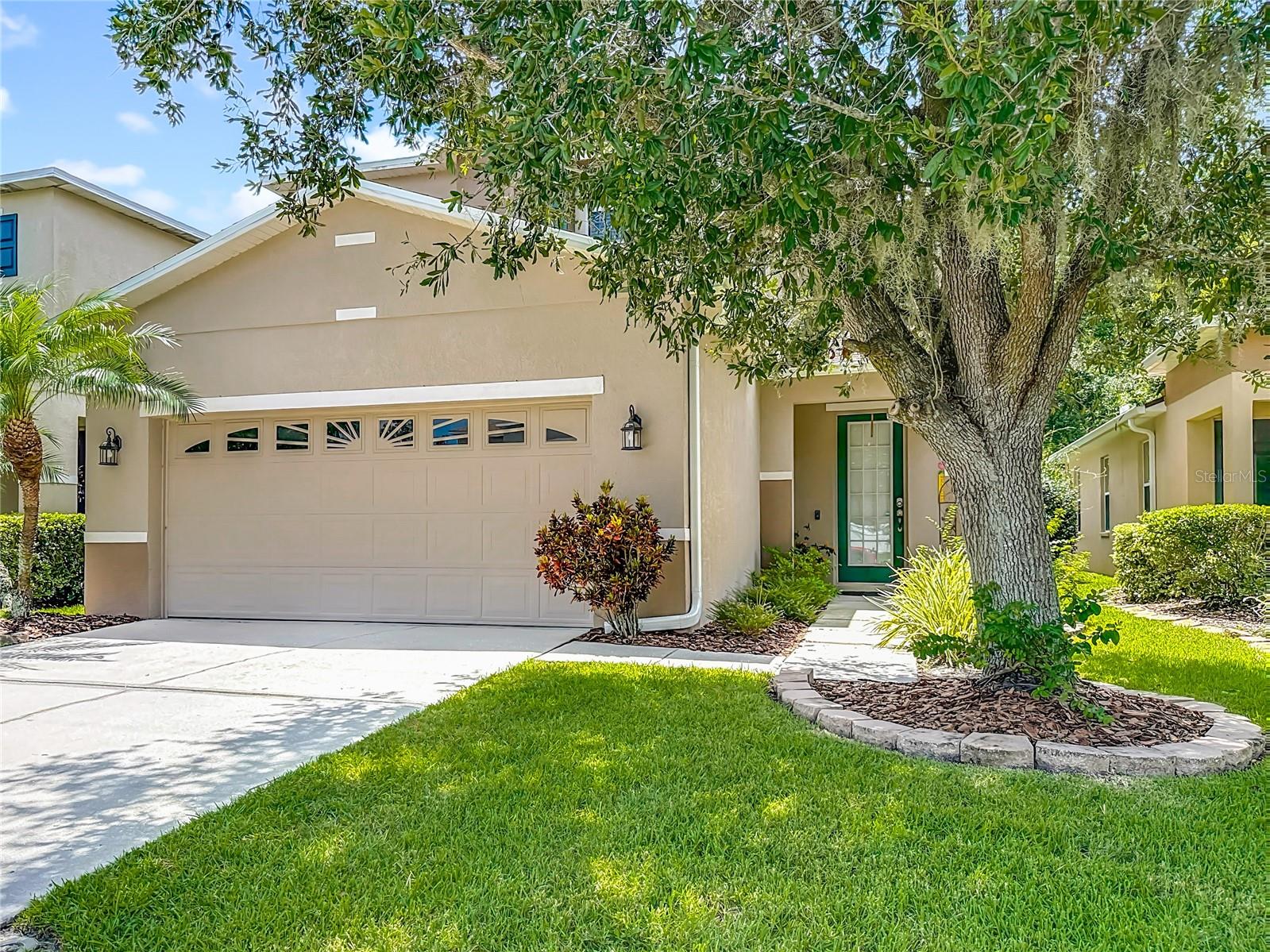 This wonderfully inviting, 3 bedroom, 2.5 bath pool home on a private conservation lot is move-in ready! Many thoughtful upgrades throughout the home include new tile flooring in the entry, living room and the kitchen. The large kitchen features stainless steel appliances, tile counters and 42 inch cabinets. The open floor plan is great for entertaining or family gatherings, with a half bath on the first floor and great views of conservation out the back. All bedrooms are up, and the large primary bedroom has an oversized walk-in closet and an upgraded primary bathroom with dual sinks and granite countertops. In the private, fully fenced backyard you can relax on the deck of your 12x24 in-ground pool with sparkling waterfall! New roof in 2025, AC 2020, new pool pump 2024, exterior painted 2021, and a newer water softener. Great location in desirable Seven Oaks community with top rated schools, resort level amenities that includes 3 pools, clubhouse with theater room, tennis courts, walking/biking trails and a new public library opening in Fall of 2025. Nearby to shopping, dining, 3 hospitals, and medical facilities - with easy access to I-75.