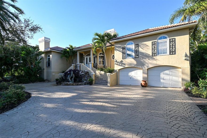 Welcome to your slice of Paradise! Nestled behind the secure Longboat Key Club Gates in Bay Isles, lies this exquisite custom home in the coveted waterfront community of THE HARBOR. Boasting a blend of timeless elegance and modern comfort, this residence underwent major renovations in 2003, with additional updates in 2023 including a new roof.

Step inside and be greeted by an elongated foyer adorned with luxurious marble flooring, leading seamlessly into the expansive great room offering breathtaking panoramic water views. The kitchen is a chef's delight, featuring an abundance of wood cabinetry, a breakfast bar, and top-of-the-line stainless steel appliances, complemented by an informal dining area.

With its open floor plan, high ceilings, and walls of glass French doors opening to the expansive covered deck, this home is an entertainer's dream. Relax by the gas fireplace or mingle with guests while enjoying the serene waterfront ambiance. The oversized formal living room and formal dining room, complete with a natural gas fireplace, provide the perfect backdrop for intimate family gatherings or elegant dinner parties.

Retreat to the primary suite through double doors and immerse yourself in luxury, with sweeping water views of the Harbor and a private fireplace. Pamper yourself in the spa-like bath, complete with two walk-in closets. Adjacent to the primary suite is a glass-encased office offering tranquil pool and harbor views. Additional living spaces include a den and a second bedroom suite on one end of the home, while a spacious third bedroom suite awaits on the opposite side.

Boasting deep water access and quick entry to Sarasota Bay, this community is a boater's paradise. The private dock at this home accommodates both large and small vessels, complete with electric and water hookups, a boat lift for a medium-sized boat, and ample dockage for larger vessels.

Conveniently located near the Longboat Key Club's golf and tennis pro shops, the Publix shopping plaza, and the Bay Isles Beach Club on the Gulf, where membership is included with your purchase, this home offers the epitome of luxury coastal living. Don't miss your chance to experience waterfront living at its finest in this exclusive Longboat Key retreat. Schedule your private showing today and make this paradise your own. Bedroom Closet Type: Walk-in Closet (Primary Bedroom).