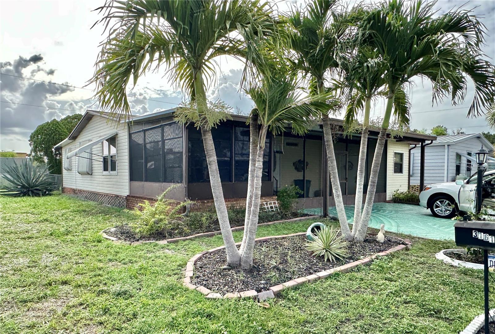 Welcome to Lake Arrowhead—North Fort Myers’ premier 55+ community where you own the land and enjoy low
maintenance fees. This beautifully updated 3-bedroom, 2-bath manufactured home blends comfort, style, and convenience in one of the area’s most sought-after neighborhoods.
Step inside to discover rich wood cabinetry, gleaming granite countertops, and stainless-steel appliances that elevate the kitchen’s appeal. The open layout features cathedral ceilings, refreshed bathrooms, updated lighting, new windows, new skylights and new epoxy flooring in the screen room and back patio adding to the curb appeal. Large green fenced in back yard provides a safe place for this pet friendly home. A brand-new roof ensures peace of mind for years to come. 3rd bedroom has a private entrance which is very nice for guest or even a renter. Ask about extra storage for RV's etc. Whether you're relaxing indoors or enjoying the vibrant community amenities, this home offers the perfect balance of privacy and connection.
Lake Arrowhead boasts a clubhouse, pool, and social activities that make every day feel like a getaway. Lake Arrowhead is conveniently
located near beaches, airports and plenty of shopping.
