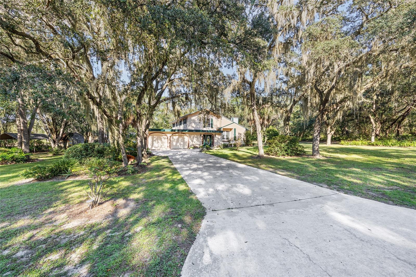Nestled on a spacious 1.53-acre lot in a highly convenient Ocala location, this two-story pool home offers a unique opportunity to enjoy modern updates with room to add your personal touch. Many of the big-ticket improvements have already been completed for you—roof (2020), septic lift station (2020), well replaced (2025), HVAC units (2019 & 2023)—providing peace of mind for years to come.
Inside, the home features a remodeled kitchen with 2021 appliances, updated cabinetry, granite countertops, and a cozy breakfast nook, ideal for family gatherings. Freshly painted rooms in 2025 bring a bright, welcoming feel throughout. Luxury vinyl floors added in the bedrooms & living room (2025). A wood-burning fireplace creates a warm focal point in the main living area, while both a formal living room and a family room offer flexible spaces for entertaining or relaxing.
Upstairs, the bedrooms are privately tucked away, offering comfort and quiet with plenty of natural light. The property’s generous footprint allows for endless possibilities—whether you envision expanding outdoor living spaces, or simply enjoying the privacy of your surroundings.
Located just minutes from shopping, dining, hospitals, and downtown Ocala, this home blends convenience with potential. With so many essential updates already complete, this is your chance to bring your vision to life in one of Ocala’s most accessible and desirable areas.