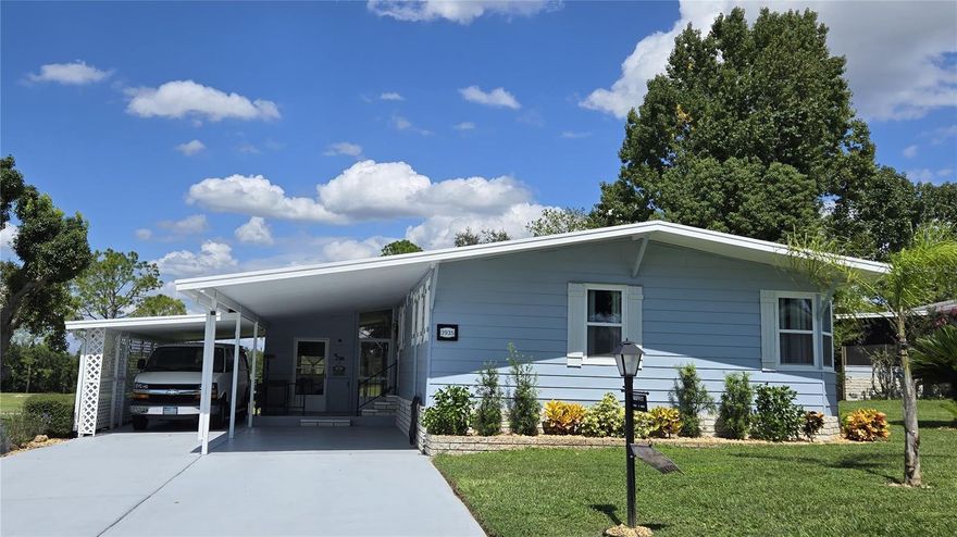 Fully renovated home in Zellwood Station, 2 bedrooms, 2 baths, with 4 seasons room and large screened patio.  Fantastic view of the golf course and walking distance to the Whistle Stop Restaurant, the HUB of our community. Plywood sub-floors with Luxury Vinyl Flooring throughout; popcorn ceilings removed and drywall throughout the house. Completely painted inside and out, Kitchen completely remodeled, granite countertops, island and stainless appliances, indoor laundry too. Large FLAT carport and storage room. This beautiful house has it all.  Zellwood Station isa Resident Owned 55+ community located between Apopka and Mt Dora.  We have a 72 Par golf course, 4 pools, pickleball and tennis courts, water exercise and line dancing classes and our own Whistle Stop Restaurant and Lounge with banquet facilities.  There is always something to do here.  Close to the 429 for easy access to airports and attractions, we are close to shopping, restaurants, medical facilities and churches. Come and see what we have to offer!