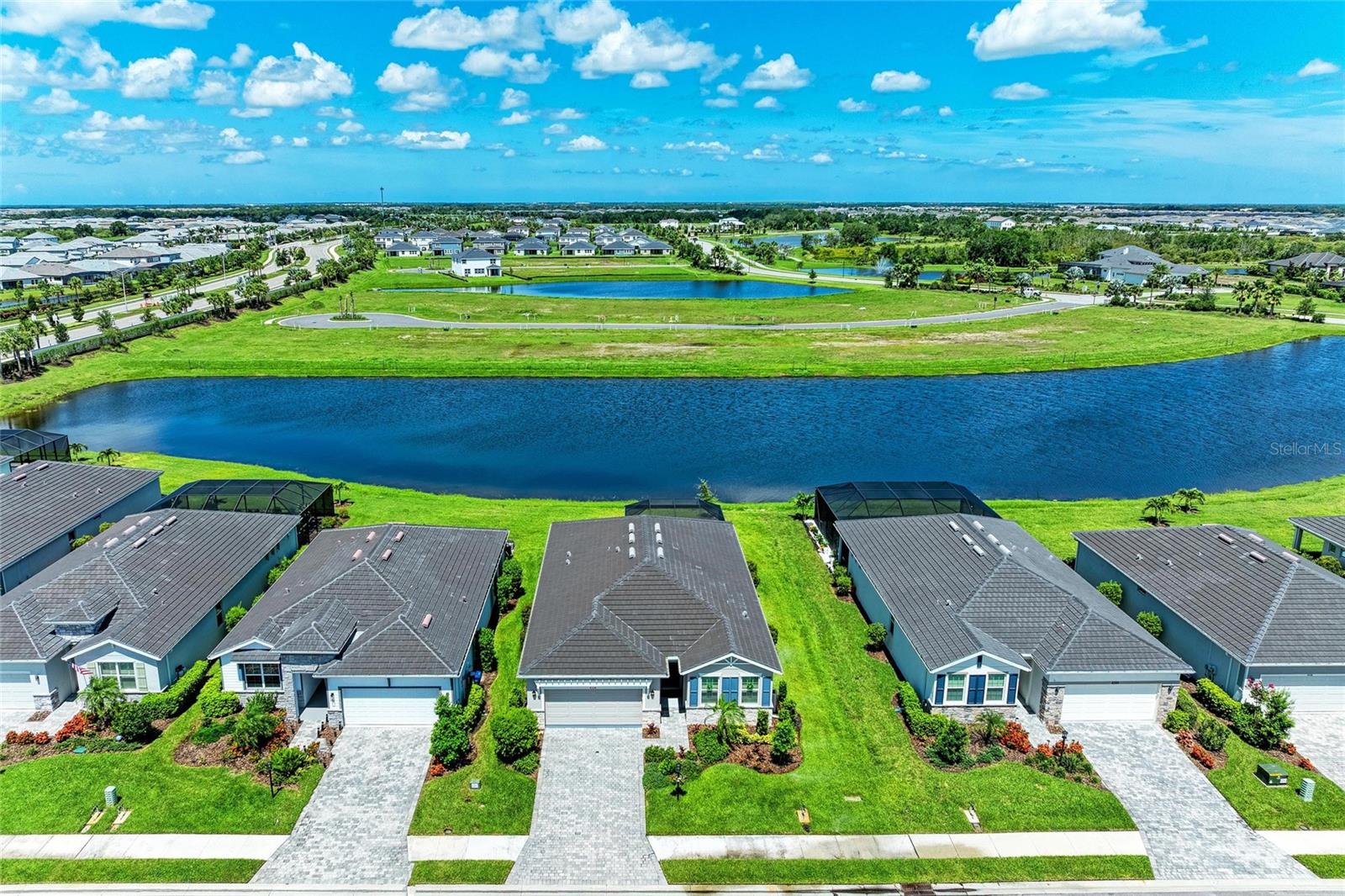 Seller agrees to credit Buyer $10,000 at closing!!! Luxury Living in Star Farms – A Delray Model Designed for Lifestyle & Comfort
Welcome to this stunning Delray model home, ideally located in the distinguished, gated Star Farms community at Lakewood Ranch. Perfectly positioned on a premium lot, this residence offers a harmonious blend of natural beauty, modern luxury, and resort-style living, ideal for active adults and families alike.
Step into an inviting open-concept design that balances spaciousness with comfort, enhanced by a freshly painted interior for a polished, move-in-ready feel. The thoughtfully designed layout offers a seamless flow from room to room, ideal for both relaxing and entertaining.
At the heart of the home is the gourmet kitchen—a culinary dream featuring premium stainless steel appliances, generous counter space, and custom upgrades including a water softener and reverse osmosis system for the purest water experience. A cozy breakfast nook includes a newly built-in buffet with extra cabinetry, perfect for added storage and effortless hosting.
The living and dining areas are equally impressive, enhanced by custom built-in shelving and crown moulding that add both elegance and function. Whether you're entertaining guests or enjoying a quiet evening, this space provides the perfect backdrop for modern living.
Retreat to the luxurious primary suite, complete with two expansive walk-in closets and a spa-like ensuite bath featuring dual vanities and a large walk-in shower.
Step outside to your private oversized custom-paved patio, newly constructed with a clear view screen that offers panoramic water views—a serene setting for morning coffee, al fresco dining, or gathering with friends as the sun sets.
Additional high-end features include plantation shutters, crown moulding throughout, and built-in features, reflecting the thoughtful attention to detail that defines this home.
As a resident of The Adventure Retreat at Star Farms, you’ll have access to world-class amenities including a private adult pool, wellness center, pickleball courts, coffee bar, restaurant, and a luxurious clubhouse. Social spaces and activity rooms cater to every interest, fostering connection, fitness, and fun.
Enjoy miles of greenways and scenic trails, ideal for walking, jogging, and biking—all within the security of a gated, nature-inspired neighborhood.
Located in the heart of Lakewood Ranch, just a short drive from Florida’s renowned Gulf Coast beaches, this property is more than a home—it’s a lifestyle.
Don’t miss your chance to own a piece of paradise. Schedule your private showing today and discover the exceptional life that awaits at Star Farms.