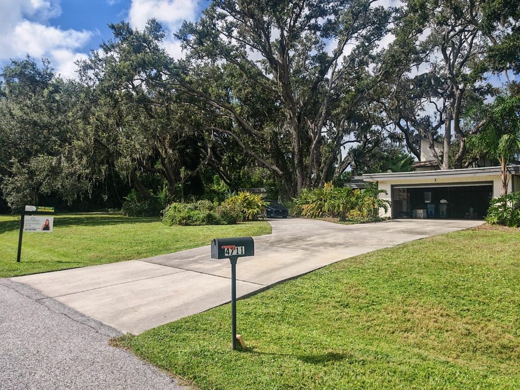 Photo of 4711 Hidden Forest Lane, Sarasota, FL 34235 (MLS # TB8434462)