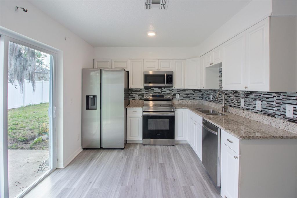 Photo of 4650 Boca Vista Court, Orlando, FL 32808 (MLS # O6374033)