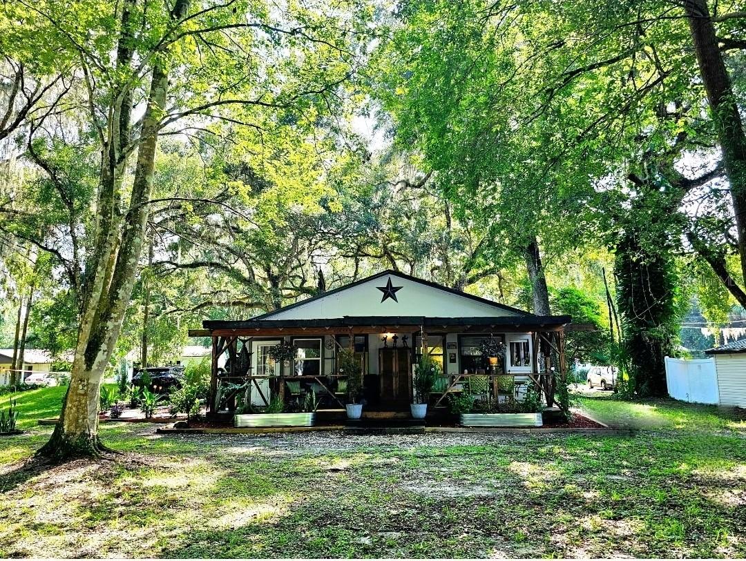 Looking for your piece of Florida paradise? Well here it is!! Check out this beautiful oasis nestled along side the Withlacoochee River. Fish or kayak right from your backyard canal, which is less than 500 ft from the main river. The world slows down the moment you step onto the property. It feels like a private retreat tucked away from the noise and demands of everyday life, yet the comfort of convenience is never far. You’re only a coupe miles from town, where shops, dining, and community events are easily within reach. This home offers a 2024 roof and a 2023 HVAC, recent updates to the kitchen and bath and beautiful flooring throughout. The functional layout is open and airy with 2 spacious bedrooms and inside laundry. The entrance foyer also doubles as a great office or sitting area to enjoy your favorite book. The spacious porch that spans the length of the home is an area dreams are made of. Overlooking the back yard to the water and trees beyond sets the tone for any get together or just quiet moments of reflection. Whether you're looking for your next home, a seasonal home or an income producing AirBnB/VRBO, this is the place for you. It's ready for it's next lucky owner to just come and enjoy everything about it. Call me for a tour. I love showing this place off! (The water in the river is very low currently. I've added photos of the home when the river is at normal level for reference.)