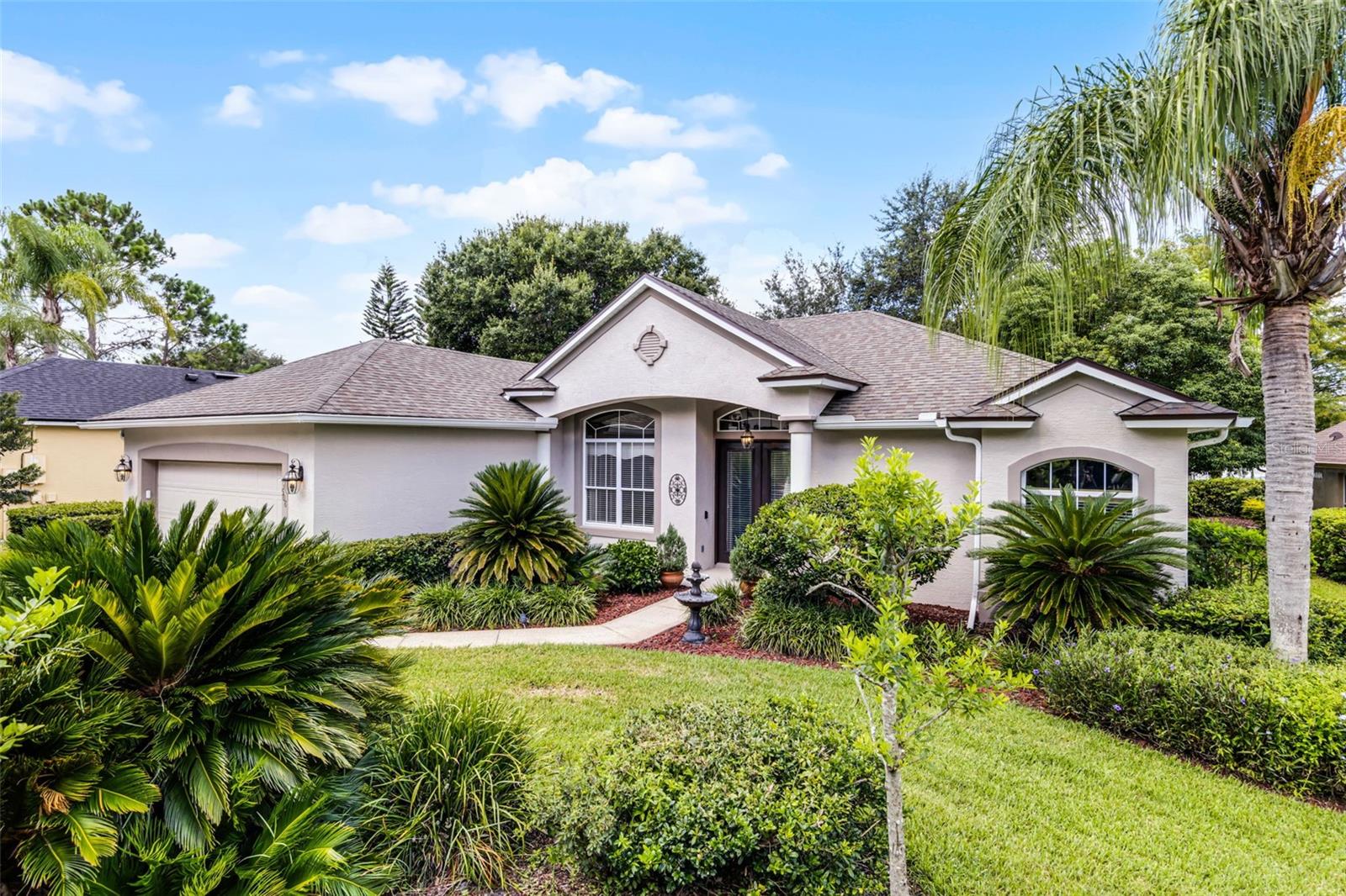 This stunning 3-bedroom, 2-bathroom home located in the highly sought-after Debary Plantation Golf Community in the City of Debary. The residence showcases elegant Maplewood floors throughout and an open-concept floor plan that highlights breathtaking panoramic views of serene Quail Lake- perfect for kayaking or canoeing. The wall sliders create a seamless indoor-outdoor living experience, while the enclosed, air-conditioned Florida room enhances the home's spacious feel. Additional features include a state-of-the-art screened room and a shaded outdoor retreat, ideal for relaxation or entertaining. The split floor plan ensures privacy, with the spacious primary bedroom located on one side of the home and the additional bedrooms on the opposite side. Just minutes from various trails, parks, restaurants, and retail shops, this home offers the perfect balance of tranquility and convenience.
