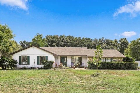 Photo of 2460 E Crooked Lake Club Boulevard, Eustis, FL 32726 (MLS # O6451877)